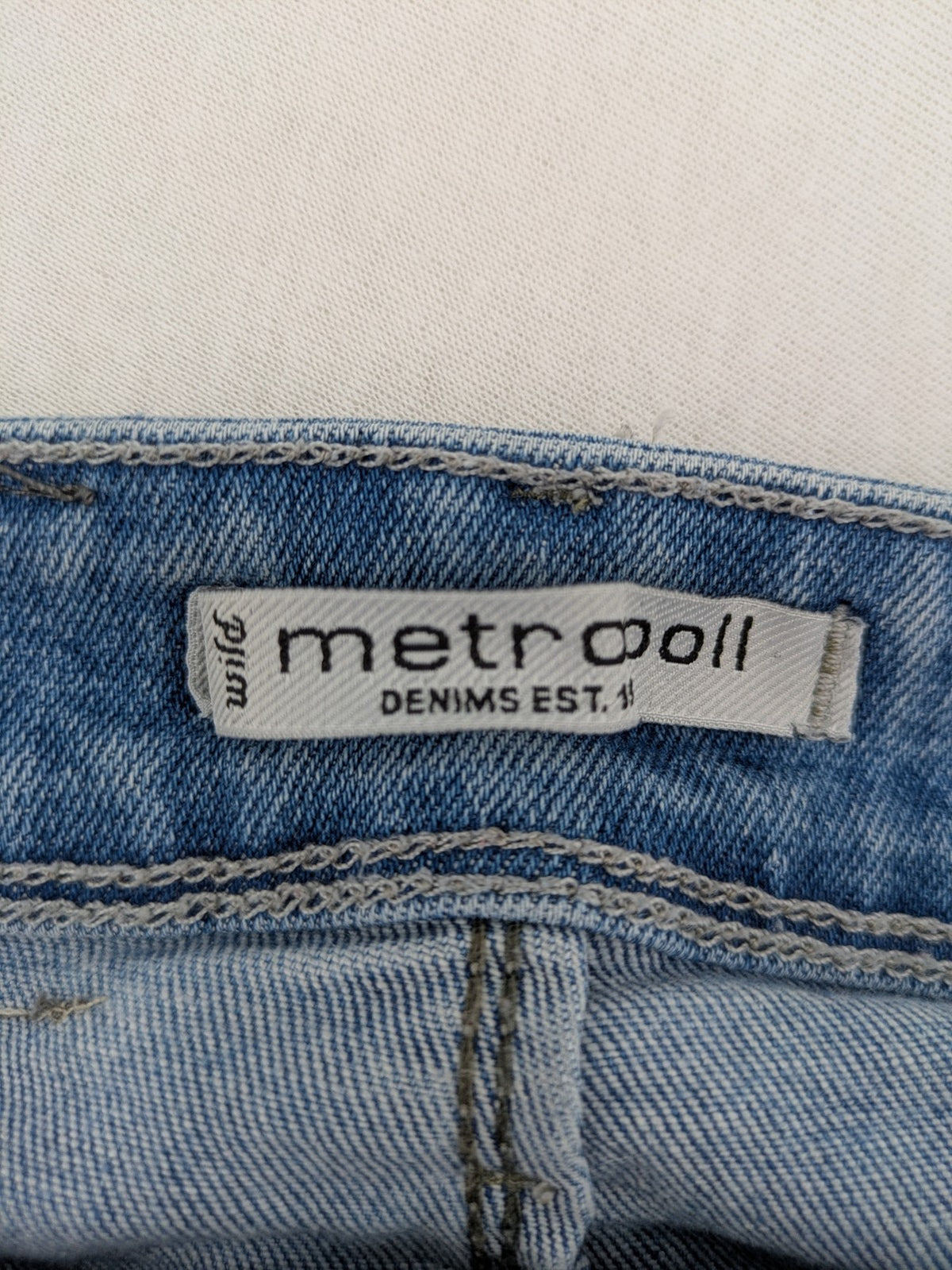 Metropoll blue high waist skinny jeans with frayed hem and classic 5-pocket design.