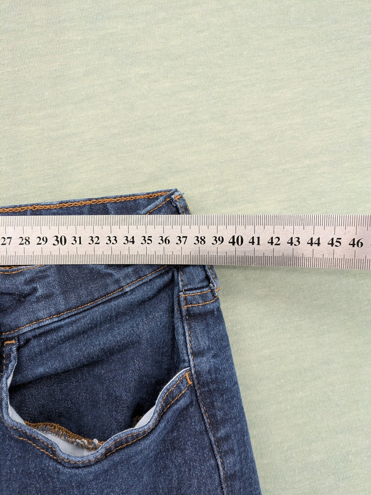H&M blue straight jeans with adjustable waistband and classic 5-pocket design.