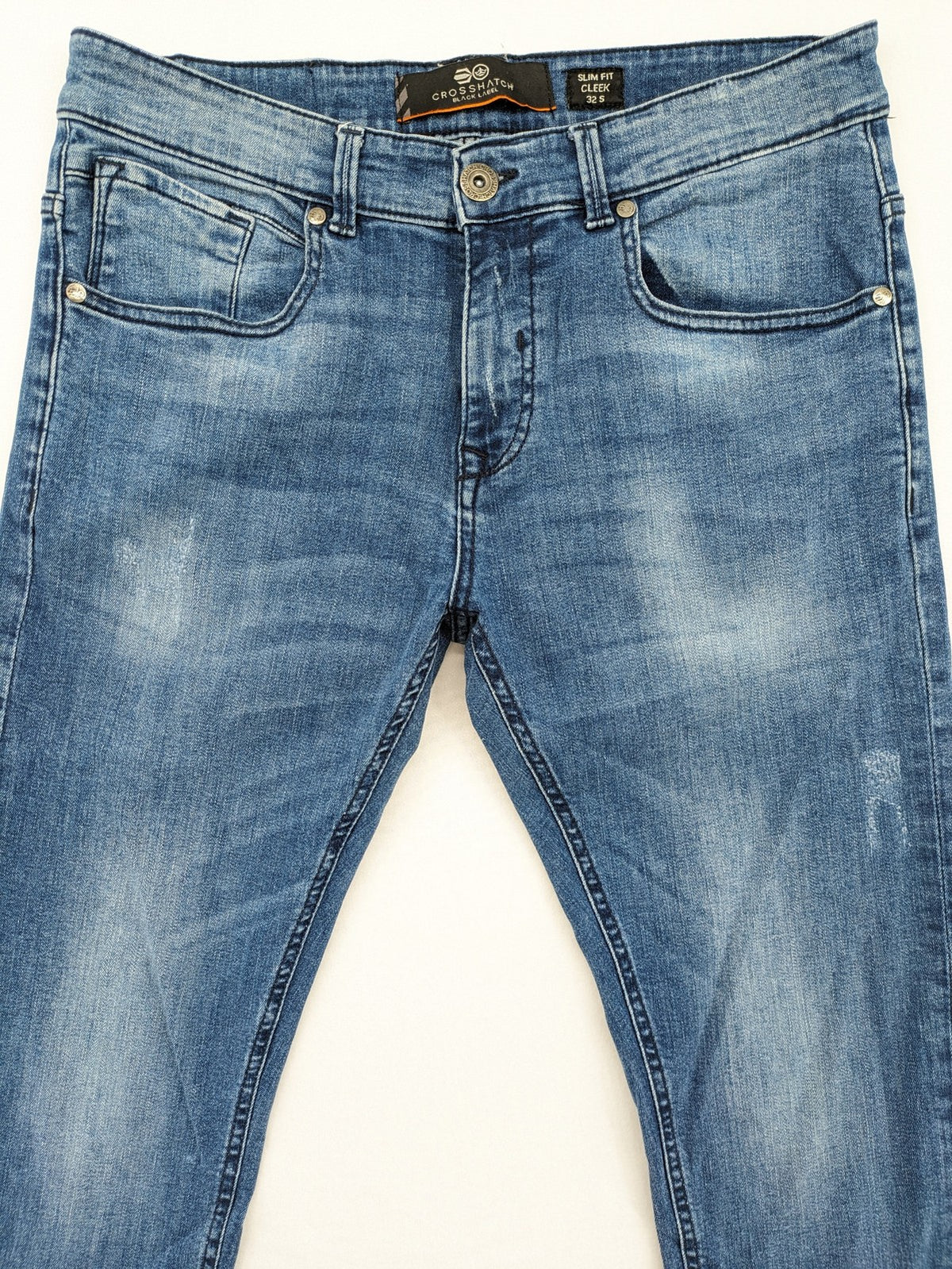 Crosshatch blue slim fit jeans with faded wash and logo patch on back pocket.