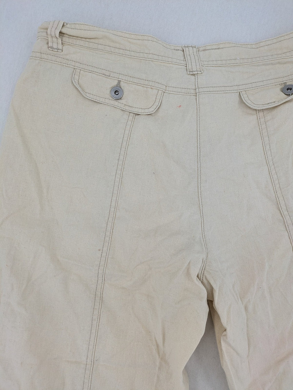 Marco Pecci beige capri pants with prominent seam details and practical pockets.