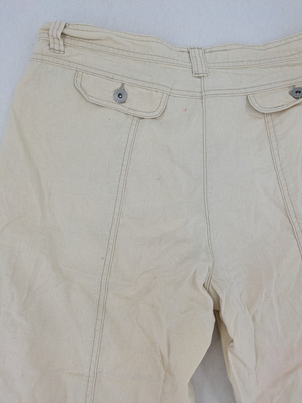 Marco Pecci beige capri pants with prominent seam details and practical pockets.