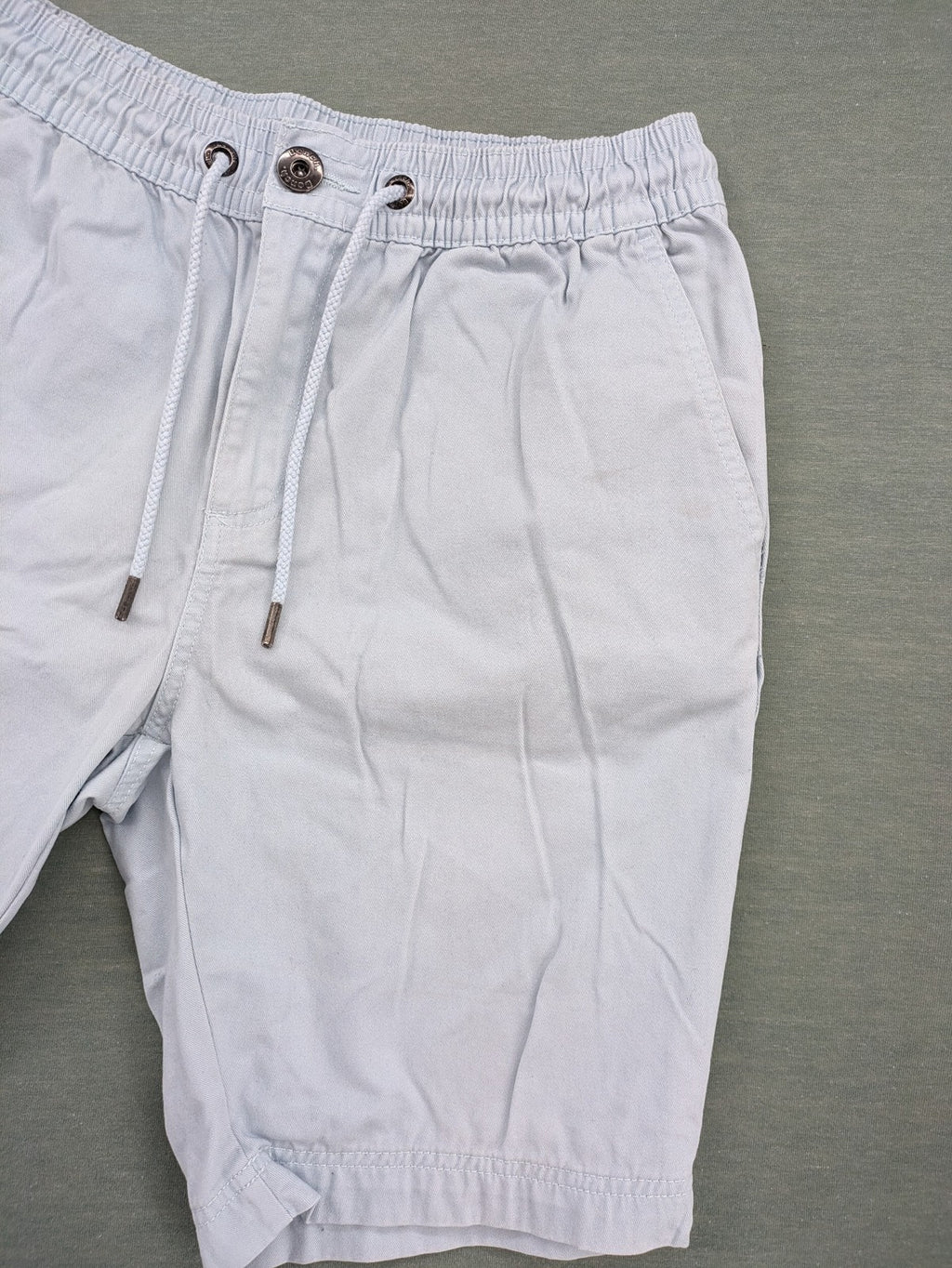Bench blue shorts with elastic waistband, drawstring, and multiple pockets.