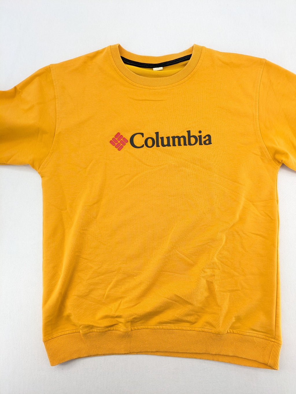 Columbia yellow turtle neck jumper with iconic logo, ribbed cuffs, and soft cotton material.