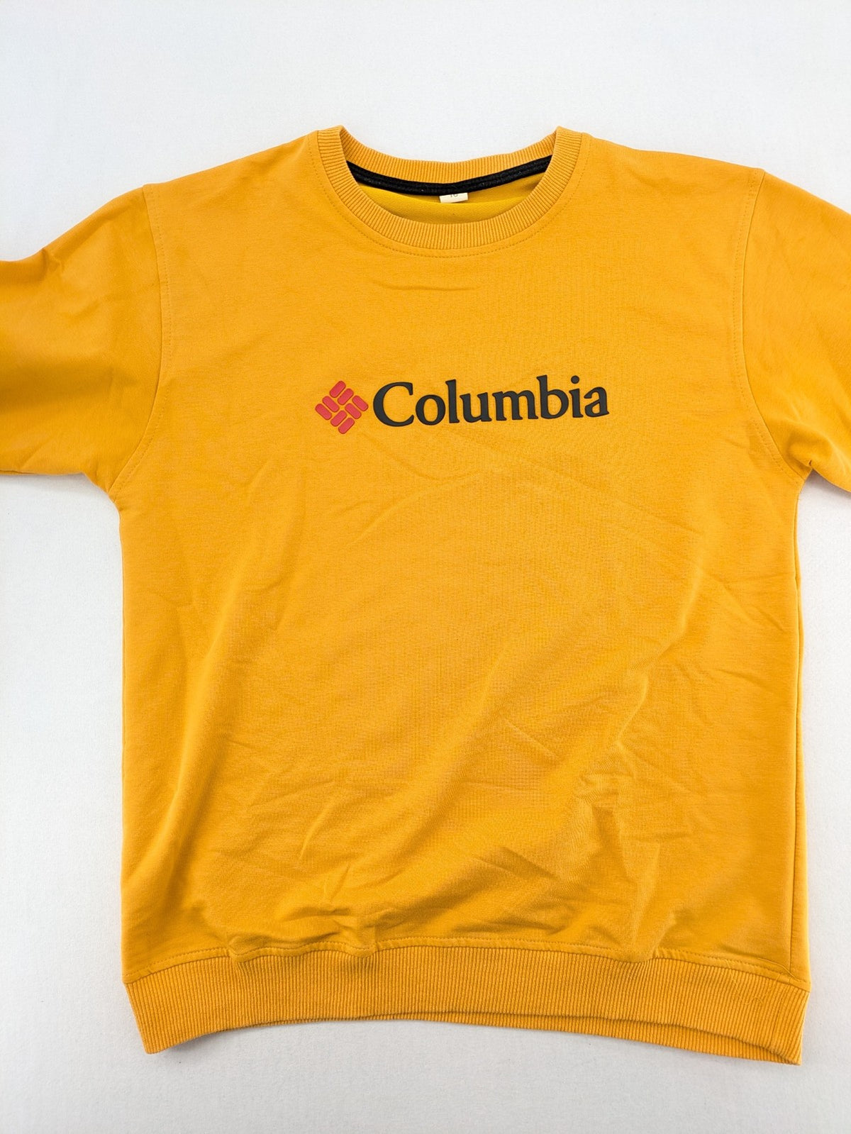 Columbia yellow turtle neck jumper with iconic logo, ribbed cuffs, and soft cotton material.