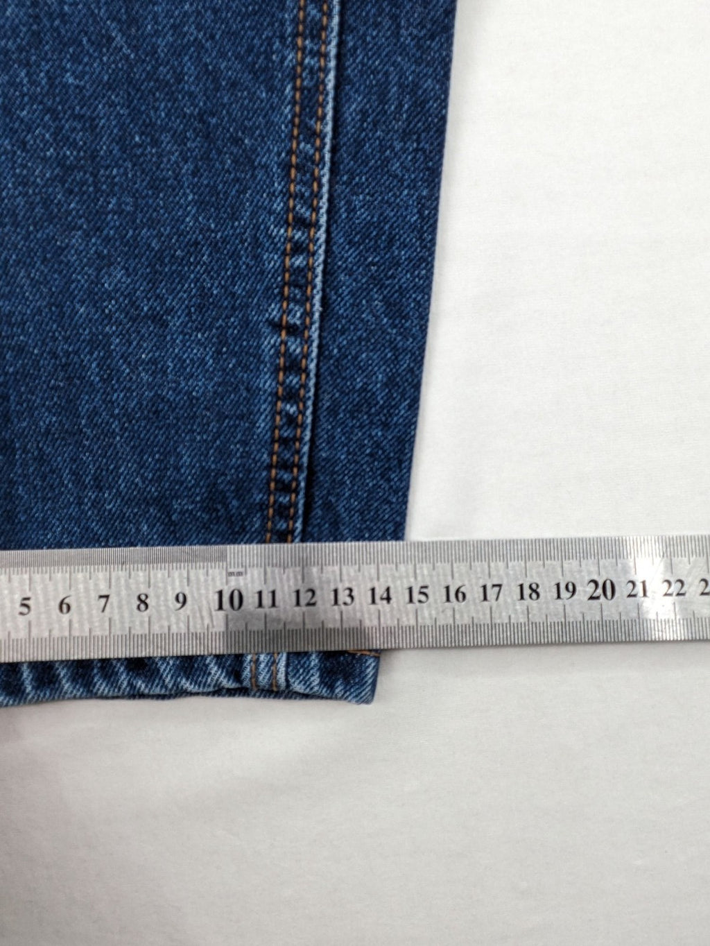 Stradivarius blue mom jeans high waist with button fly and classic denim texture.