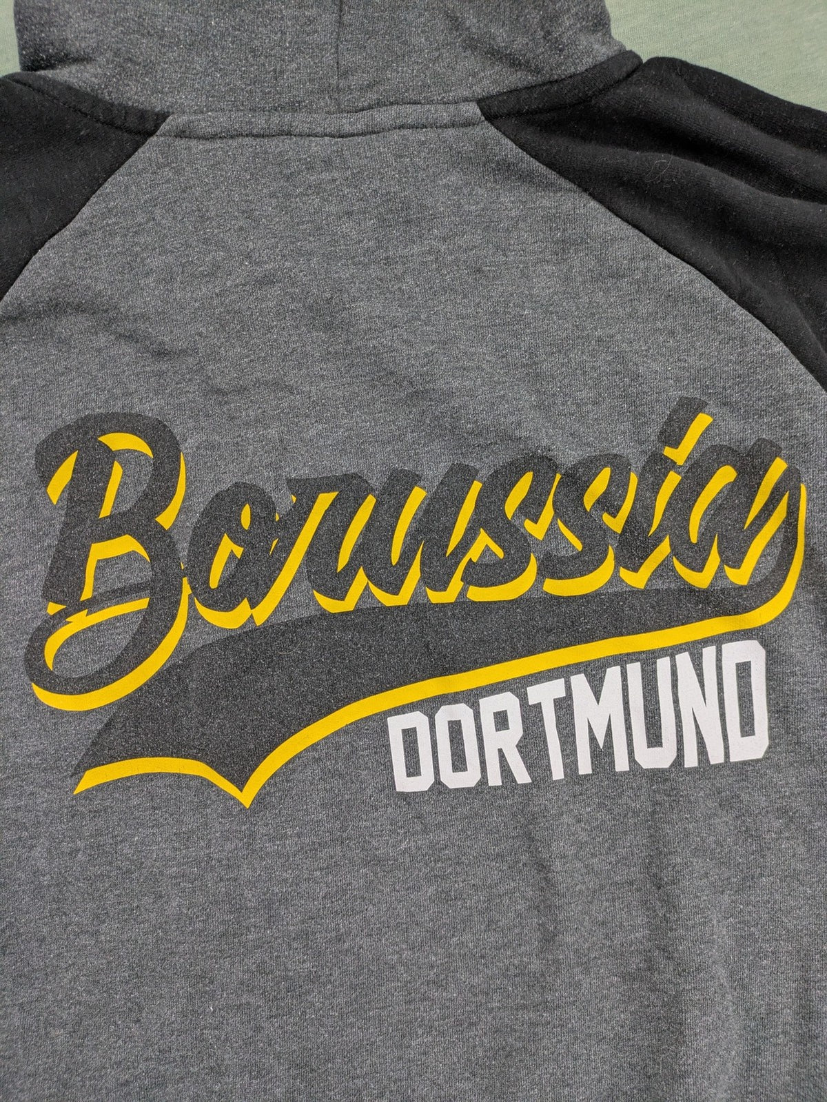 Borussia Dortmund grey and black hoodie with BVB 09 logo and full zip design.