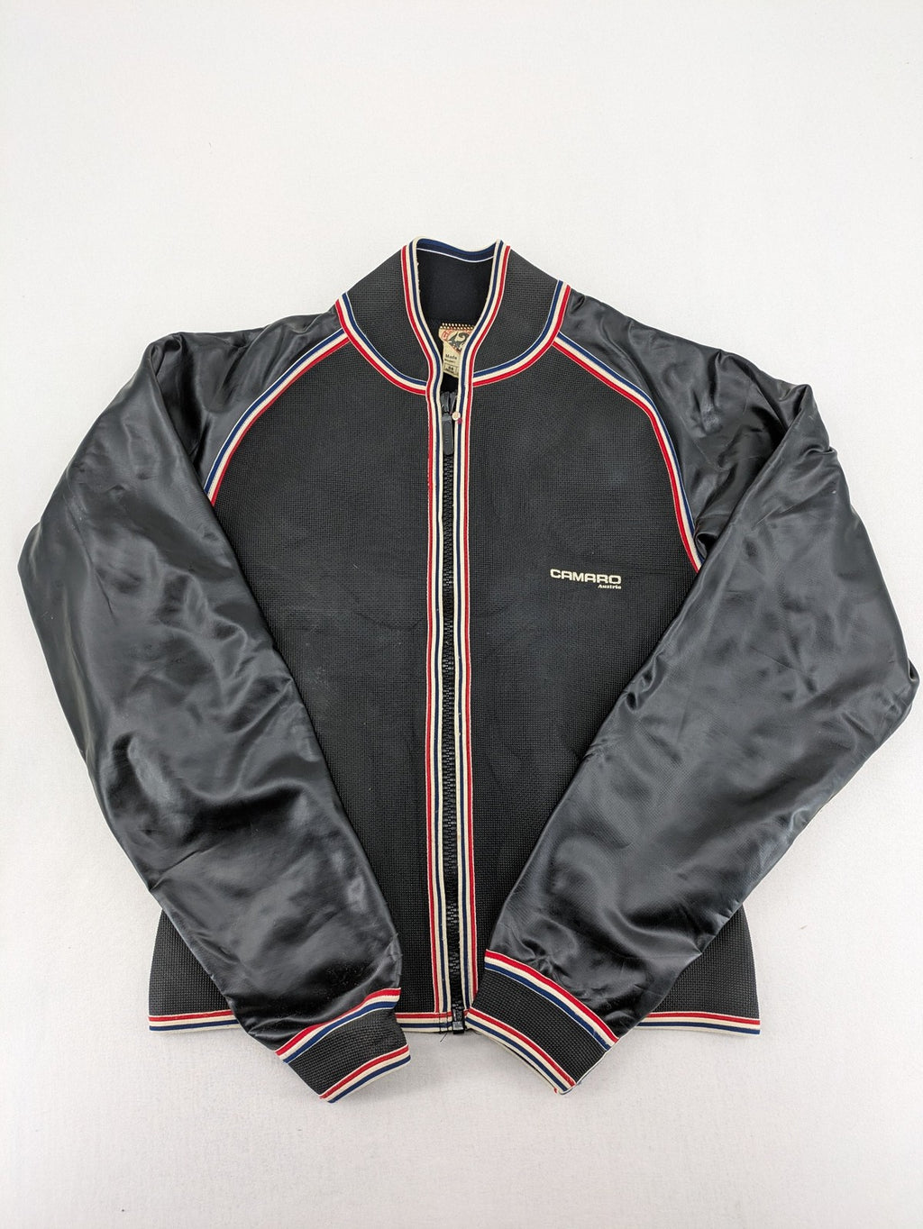 Camaro vintage jacket multi-colour with striped accents and structured body.