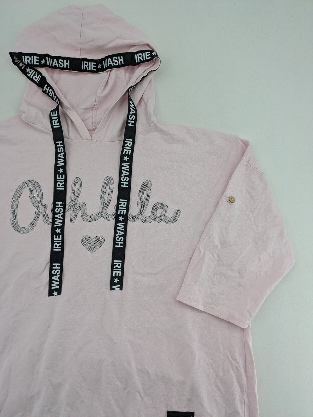 Irie pink turtle neck jumper with "Oohlala" rhinestone lettering and logo drawstrings.