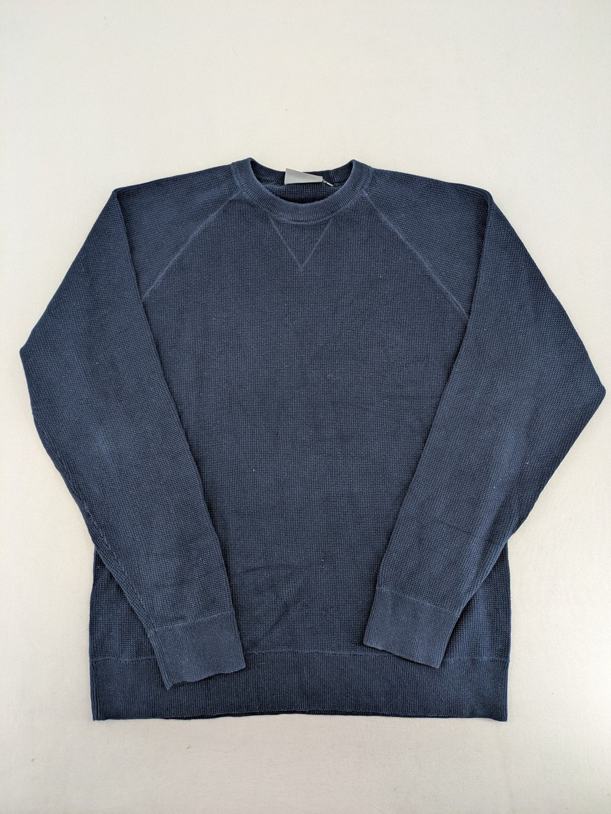 Carhartt navy turtle neck jumper waffle knit texture with subtle logo on sleeve.