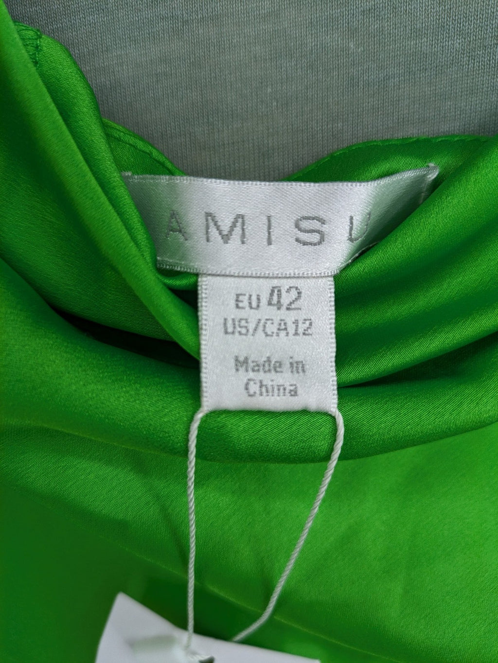 Amisu green satin slip dress with waterfall neckline and adjustable side ruching.