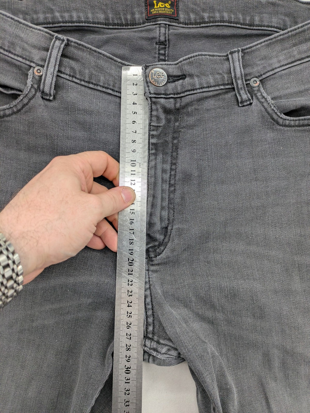 Lee straight jeans grey 5-pocket design with subtle branding on back pocket.
