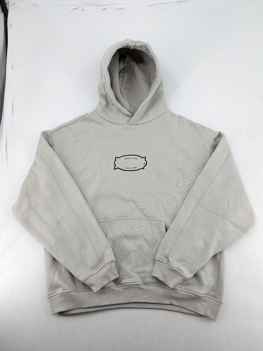Multiply grey zip-through hoodie with embroidered logo and large "MLTPLY" print on back.