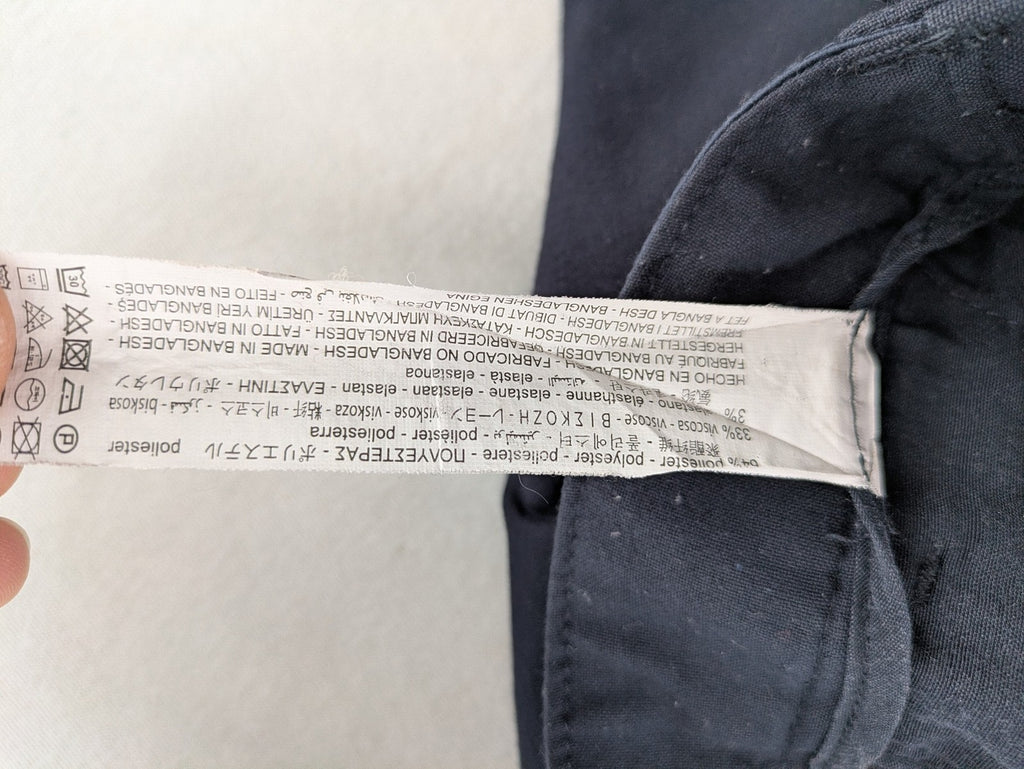 Zara navy chinos flat front design with stretch fabric for comfort and versatility.
