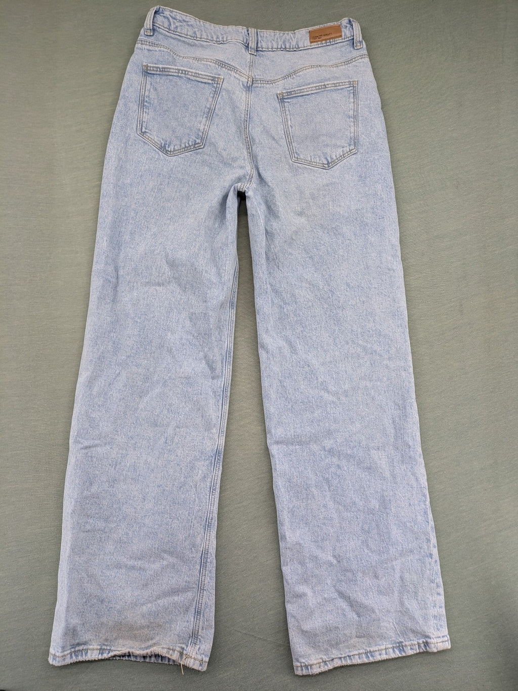 C&A blue wide leg jeans with distressed knee details and classic five-pocket design.