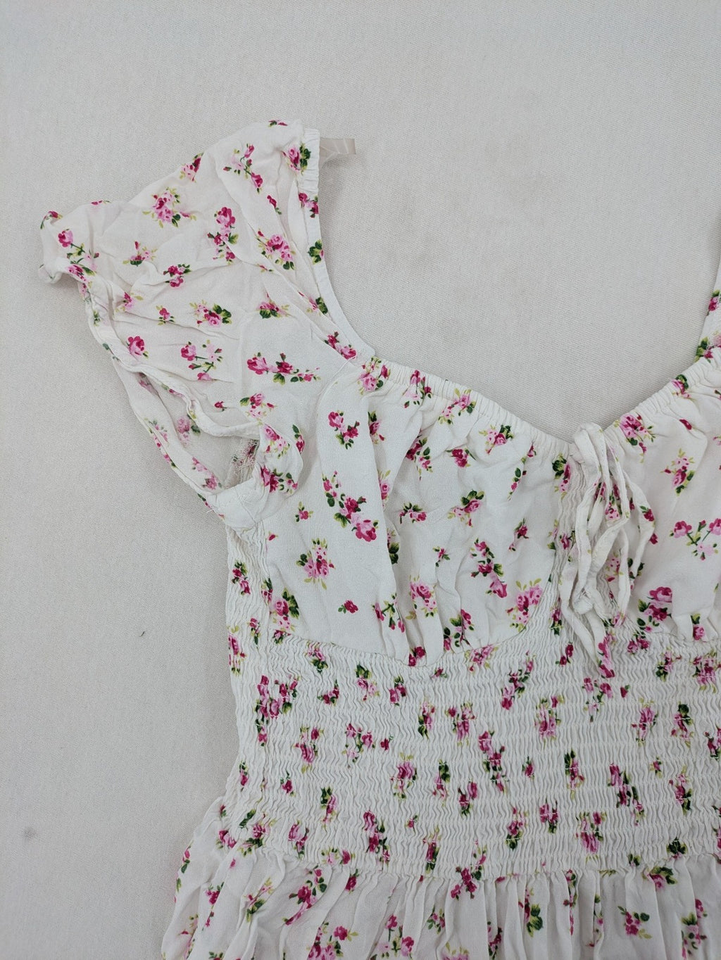 FB Sister floral playsuit white with pink flowers, smocked bodice, lightweight viscose material.