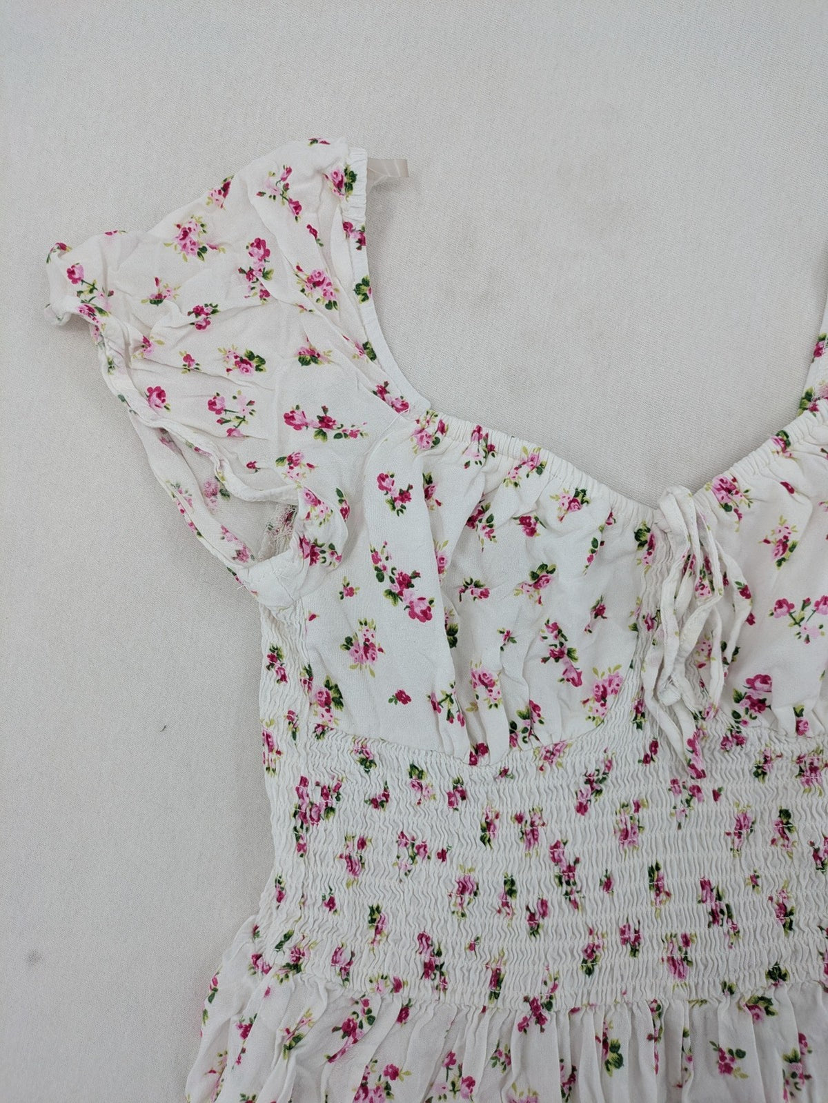 FB Sister floral playsuit white with pink flowers, smocked bodice, lightweight viscose material.