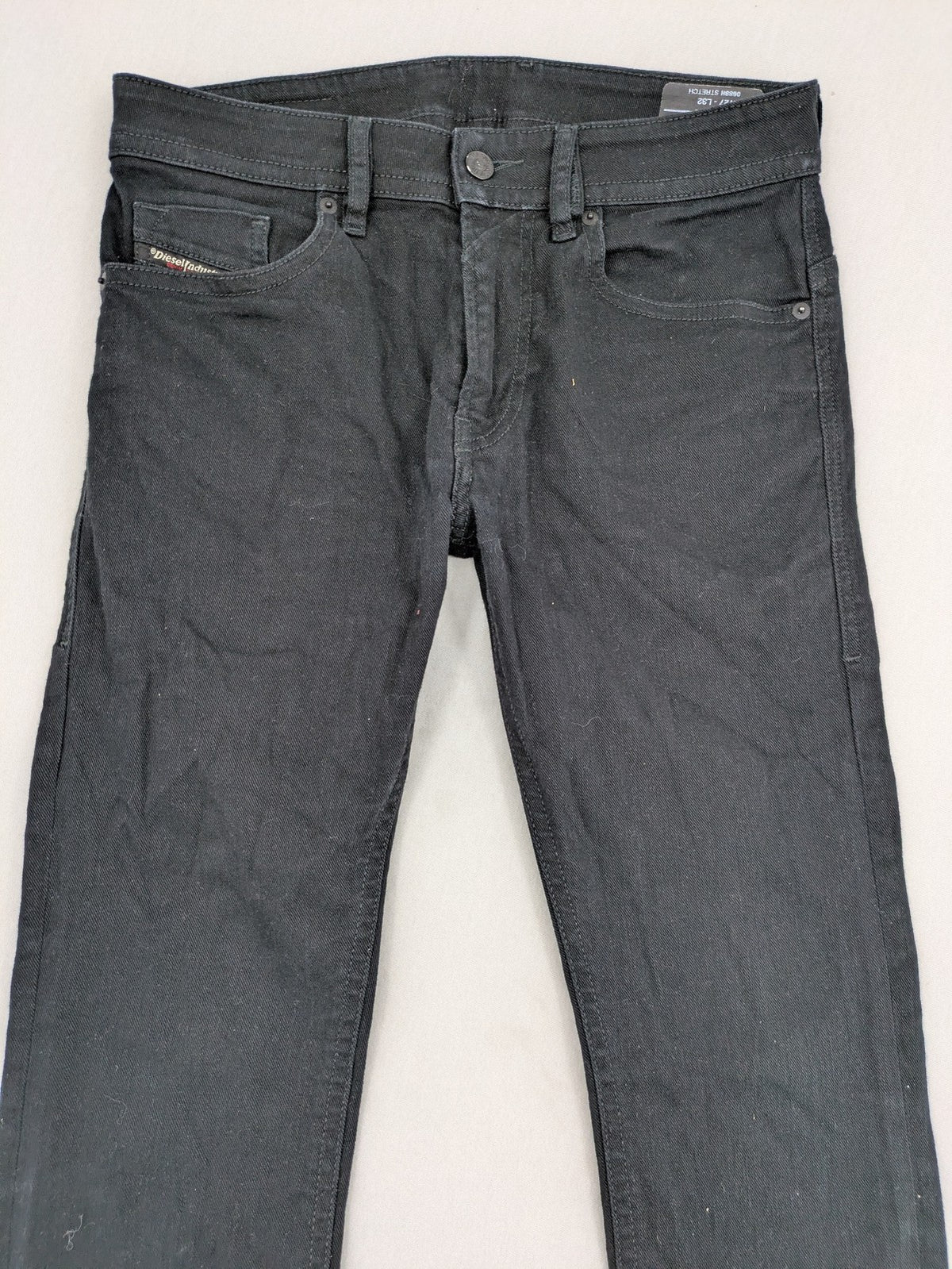 Diesel black Thommer Slim jeans with classic 5-pocket design and stretch material.