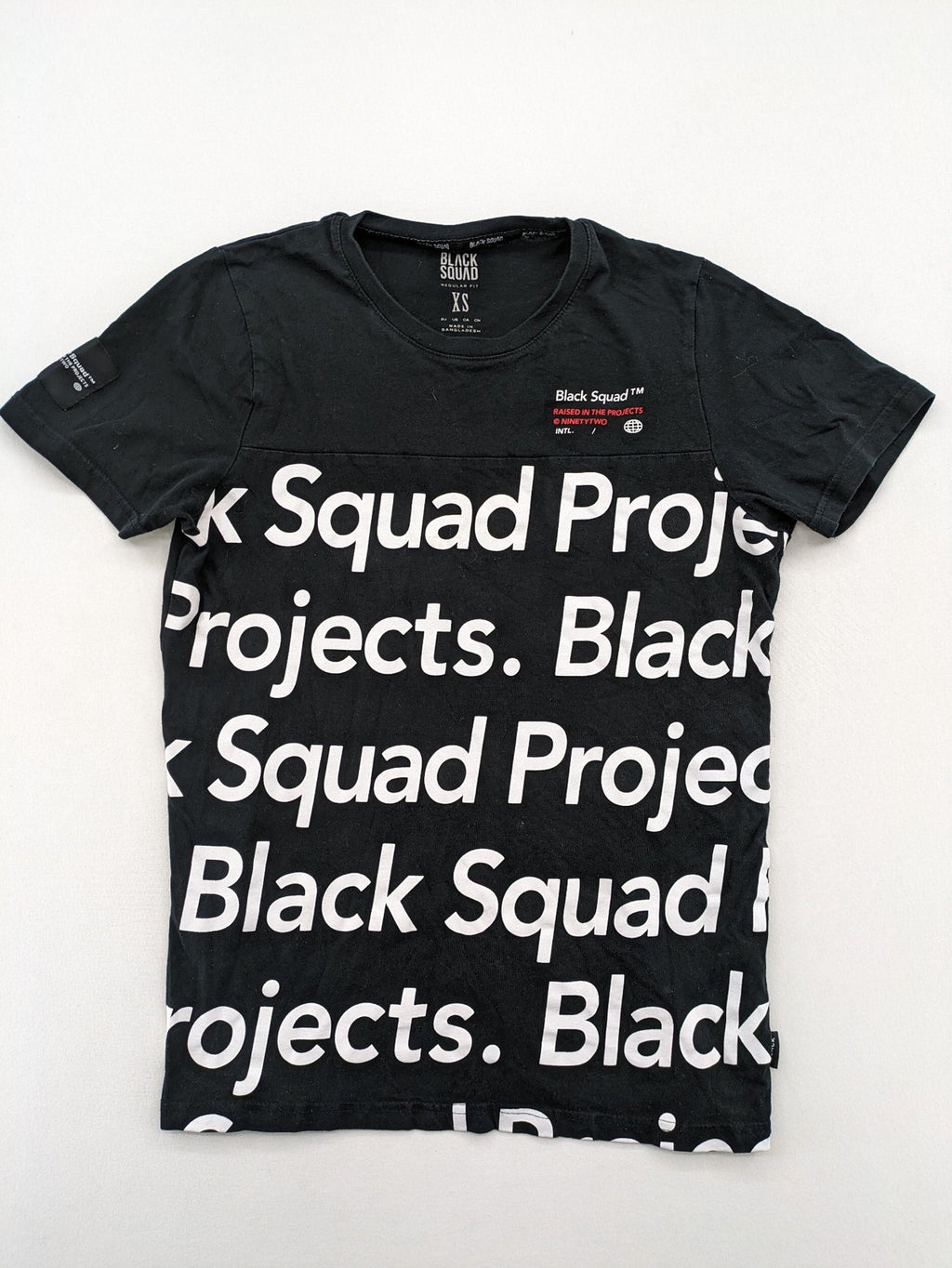 Black Squad black t-shirt all-over graphic print with logo patch on sleeve.