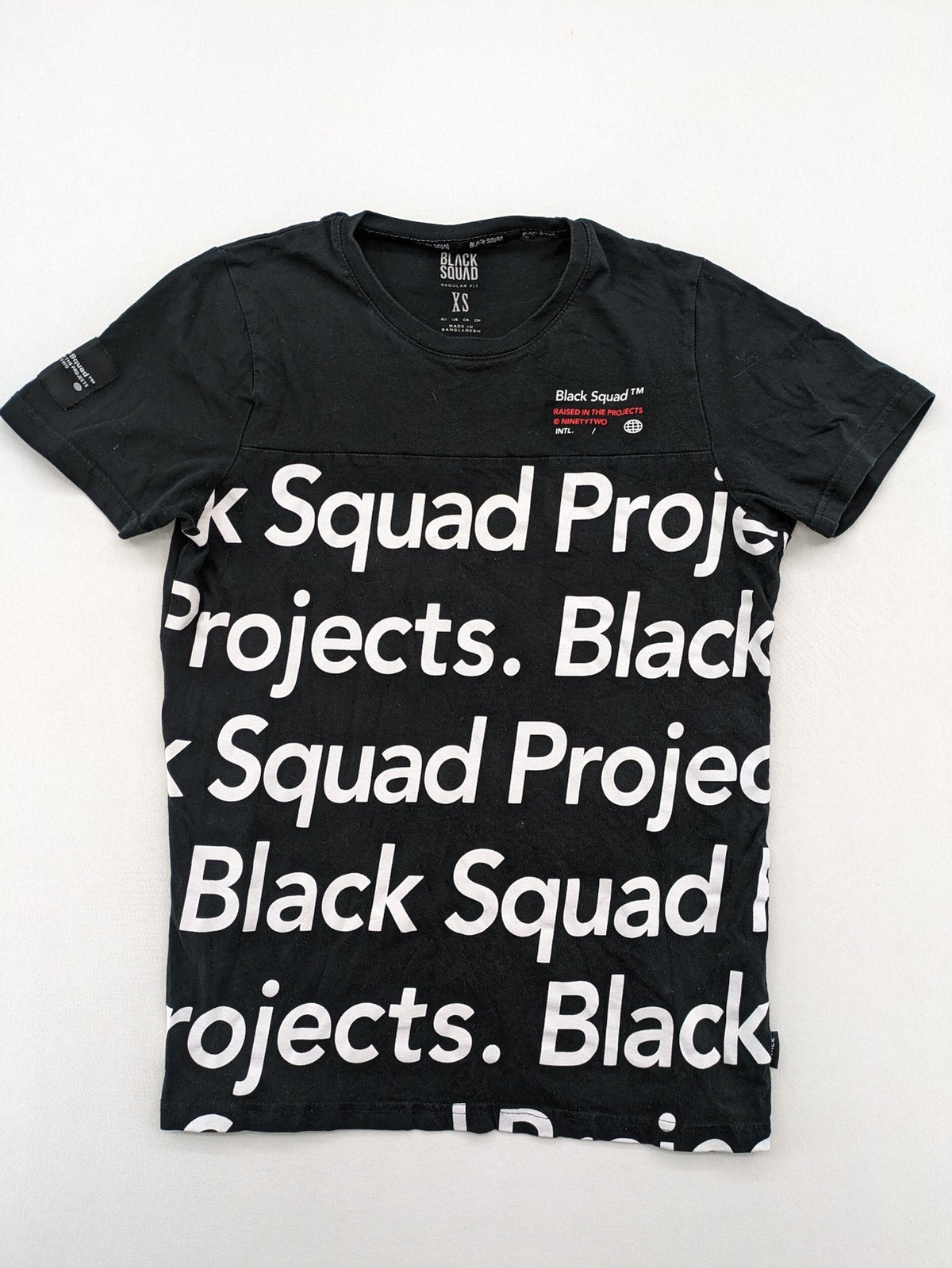 Black Squad black t-shirt all-over graphic print with logo patch on sleeve.