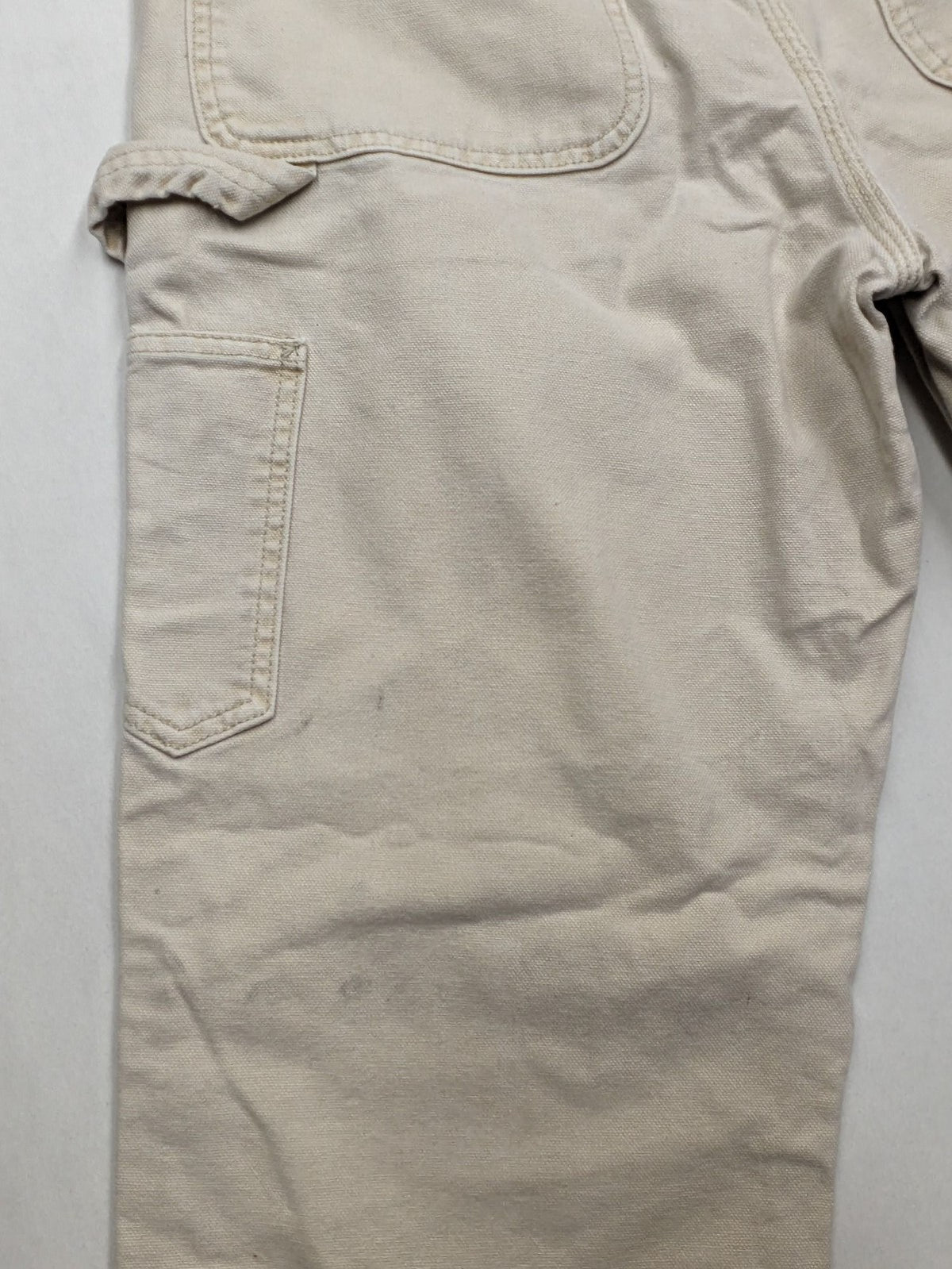 Pull&Bear beige carpenter pants with classic zipper, belt loops, and durable cotton material.