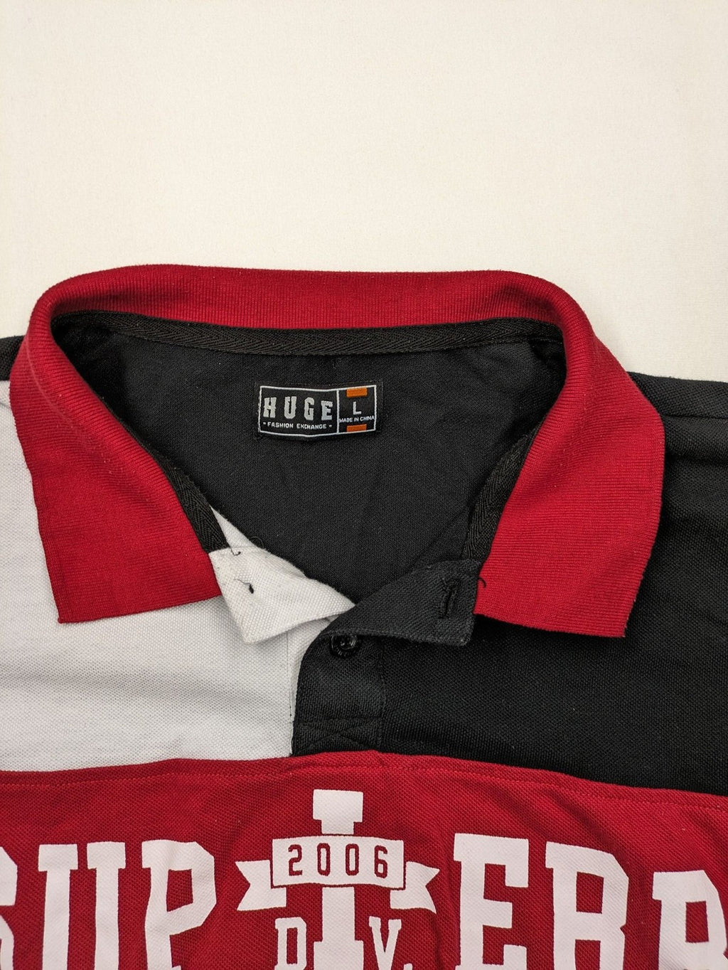 Huge Fashion Exchange rugby polo shirt red and black striped with "SUPERB" graphic.
