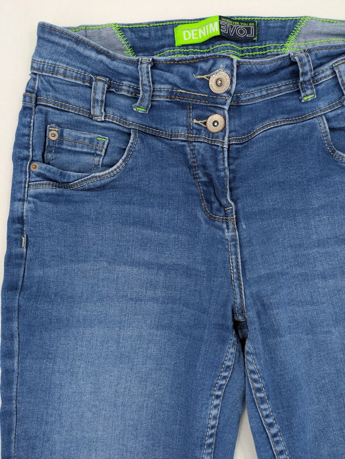 Cecil blue straight jeans with neon green accents and classic 5-pocket design.