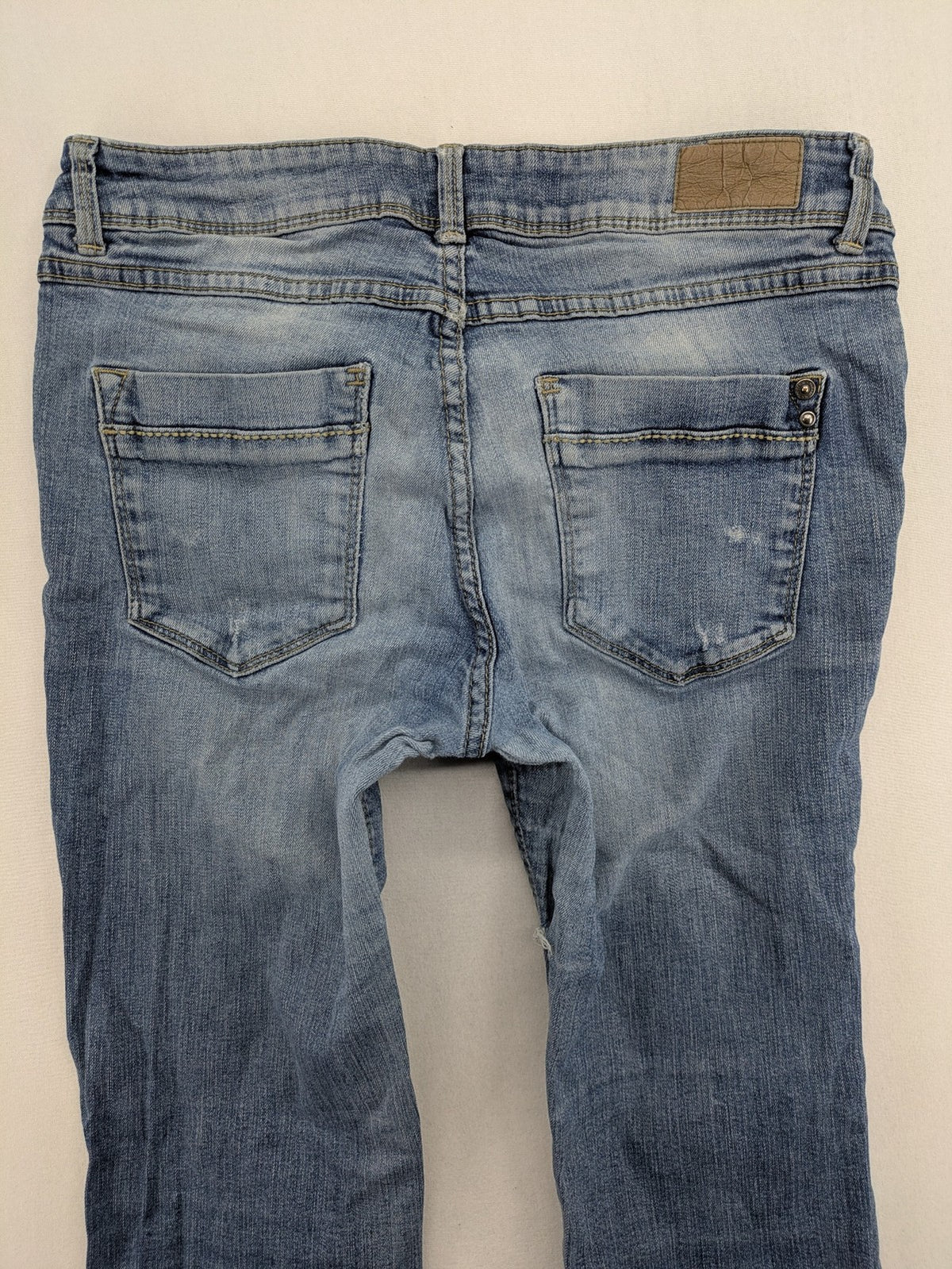 C&A blue bootcut jeans with faded denim and low rise fit, made from cotton blend.