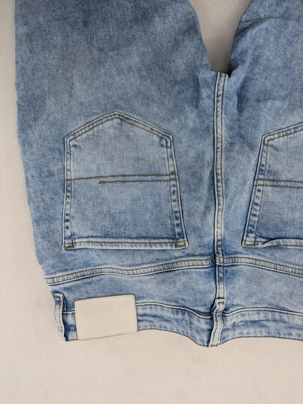 Oskar blue slim fit jeans with classic 5-pocket design and light wash.