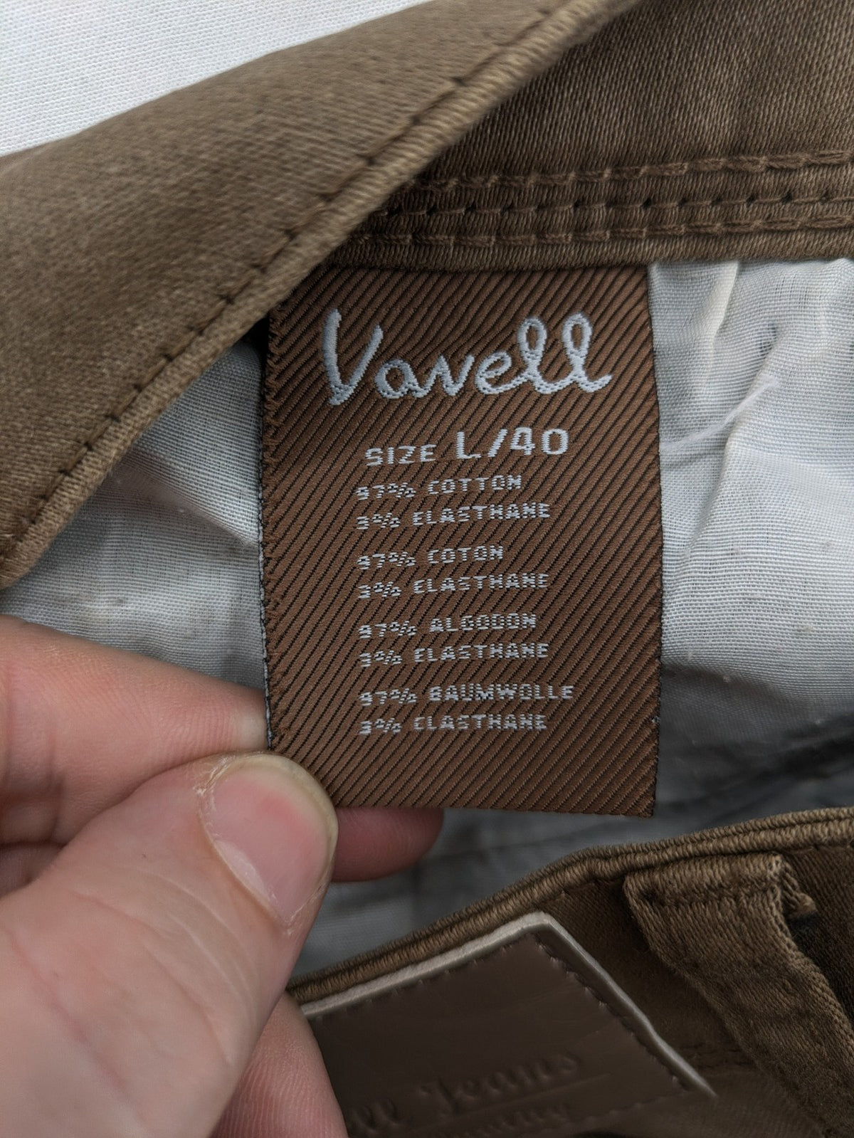 Vavell khaki skinny jeans five-pocket design with unique front zipper detail.