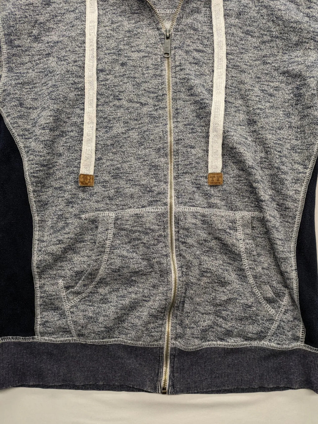 Tom Tompson cream turtle neck jumper with dark blue accents and graphic details on sleeve.