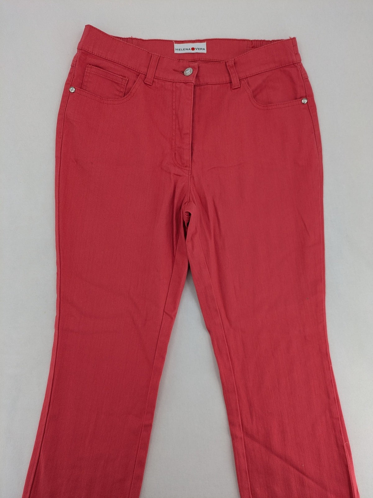 Helena Vera red straight jeans with elastic waistband and rhinestone details on pockets.