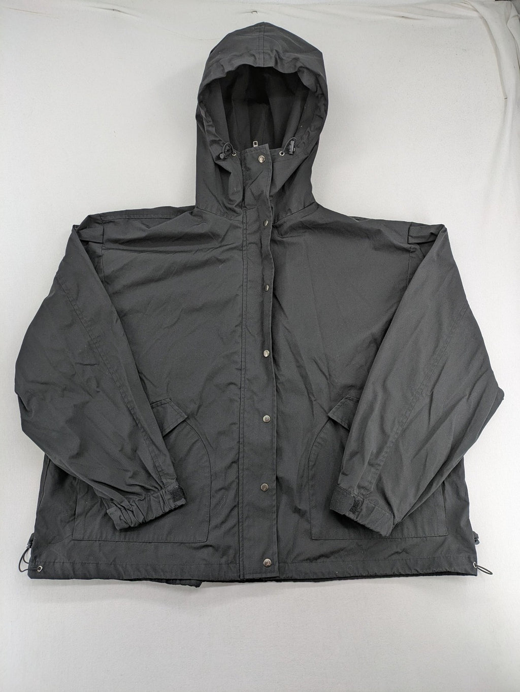 Hypnotism grey windbreaker jacket with hood, snap buttons, and zip closure.