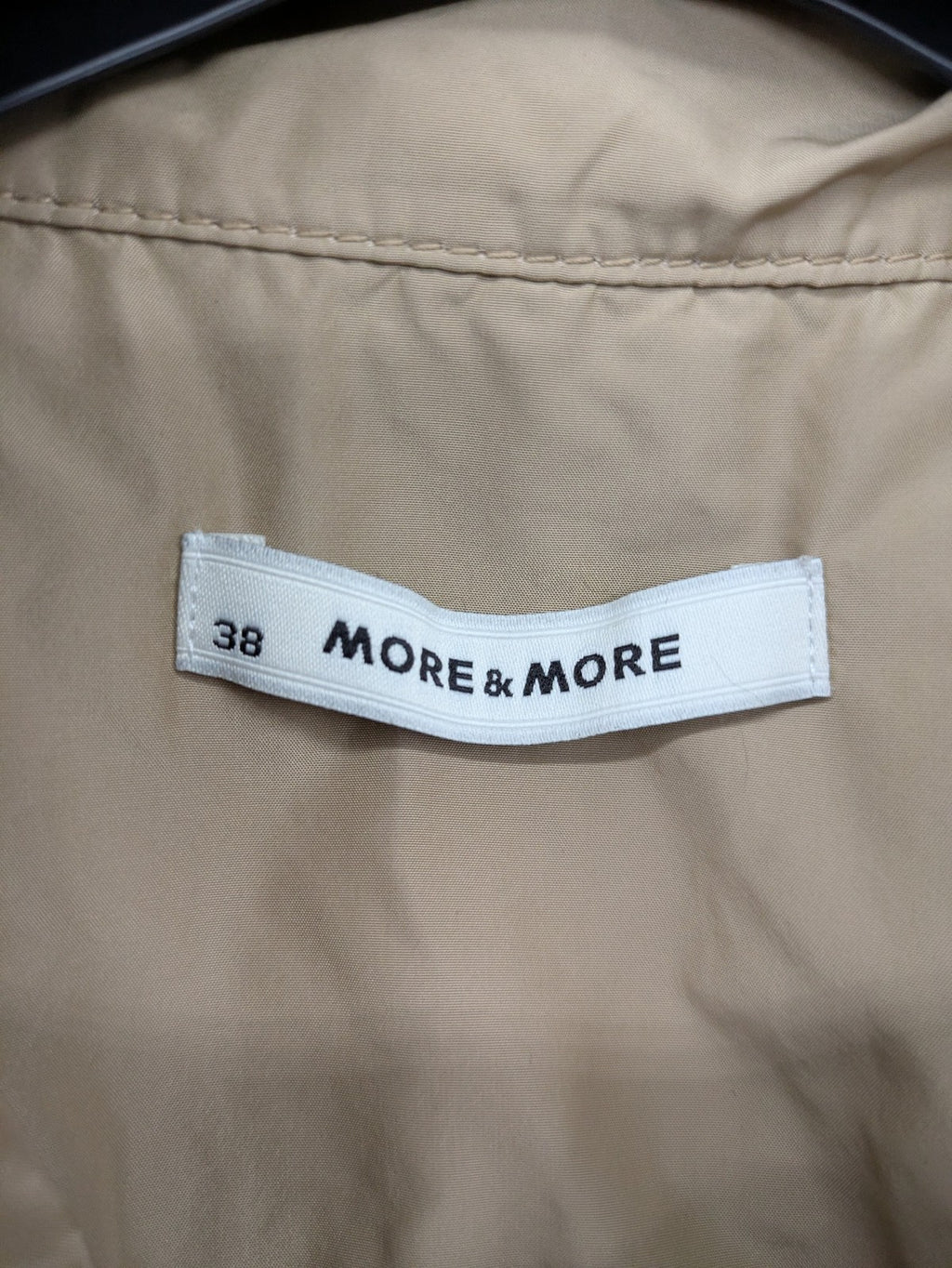 MORE & MORE beige field jacket with belt, four pockets, and standing collar.