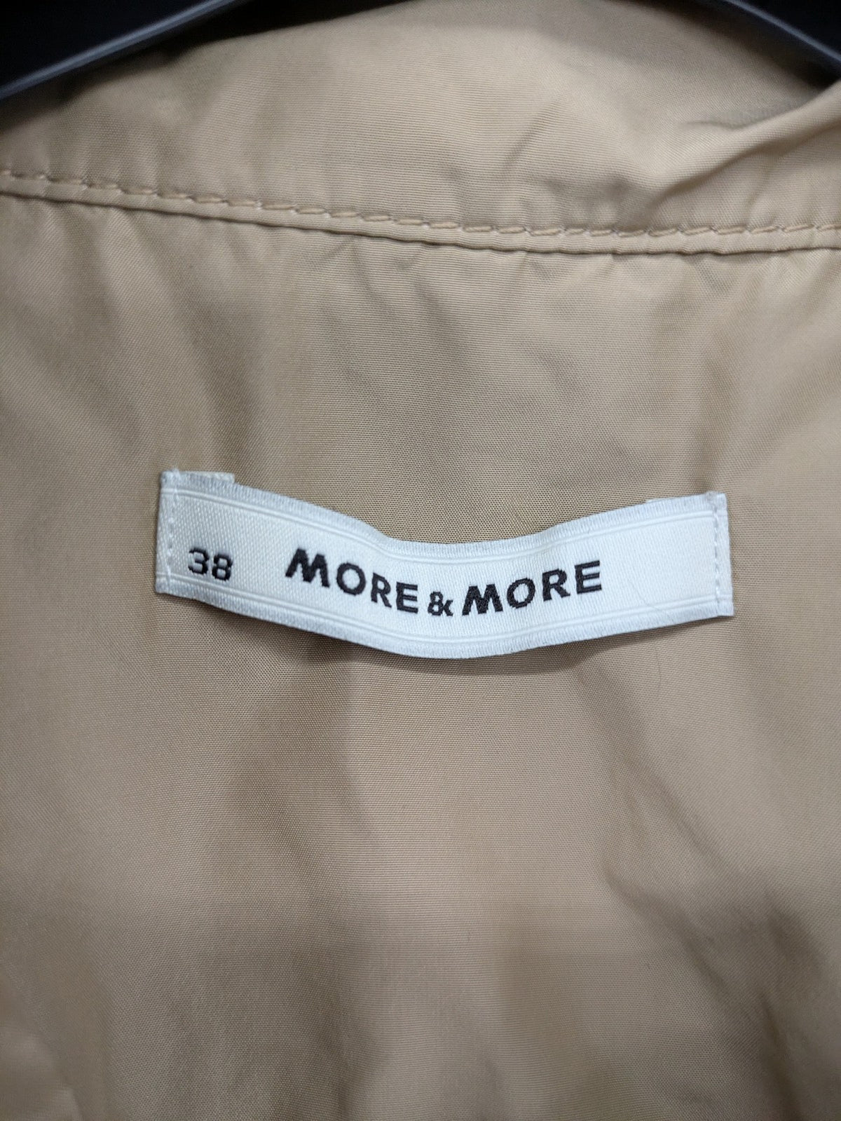 MORE & MORE beige field jacket with belt, four pockets, and standing collar.