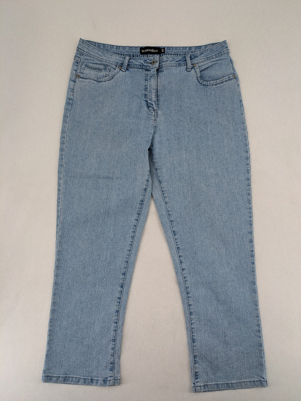 Capri blue straight jeans with 5-pocket design and embroidered details on back pockets.