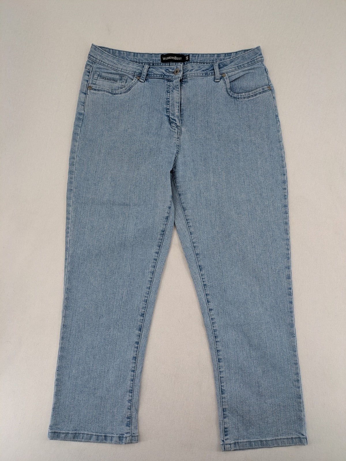 Capri blue straight jeans with 5-pocket design and embroidered details on back pockets.