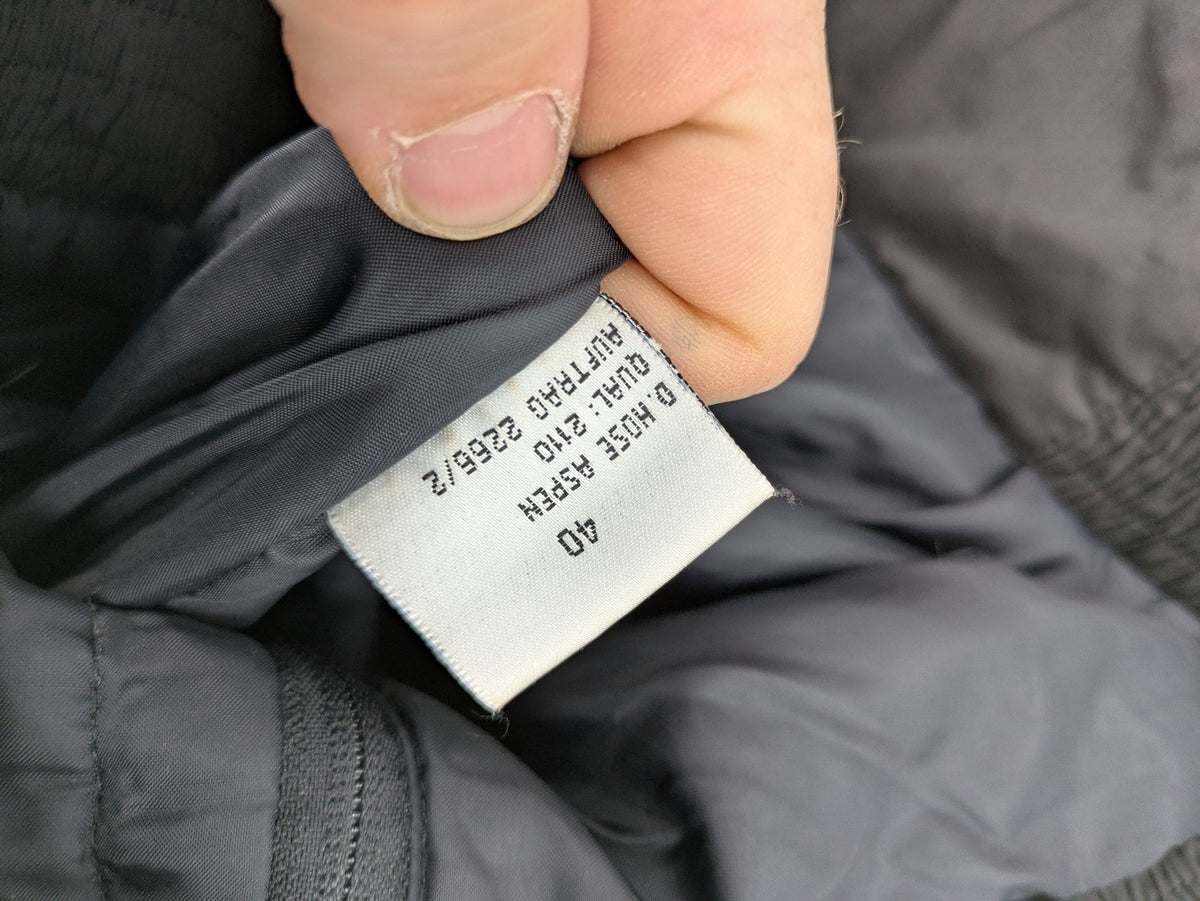 GEF black ski pants size 40, insulated, featuring zippered cuffs and snow gaiters.