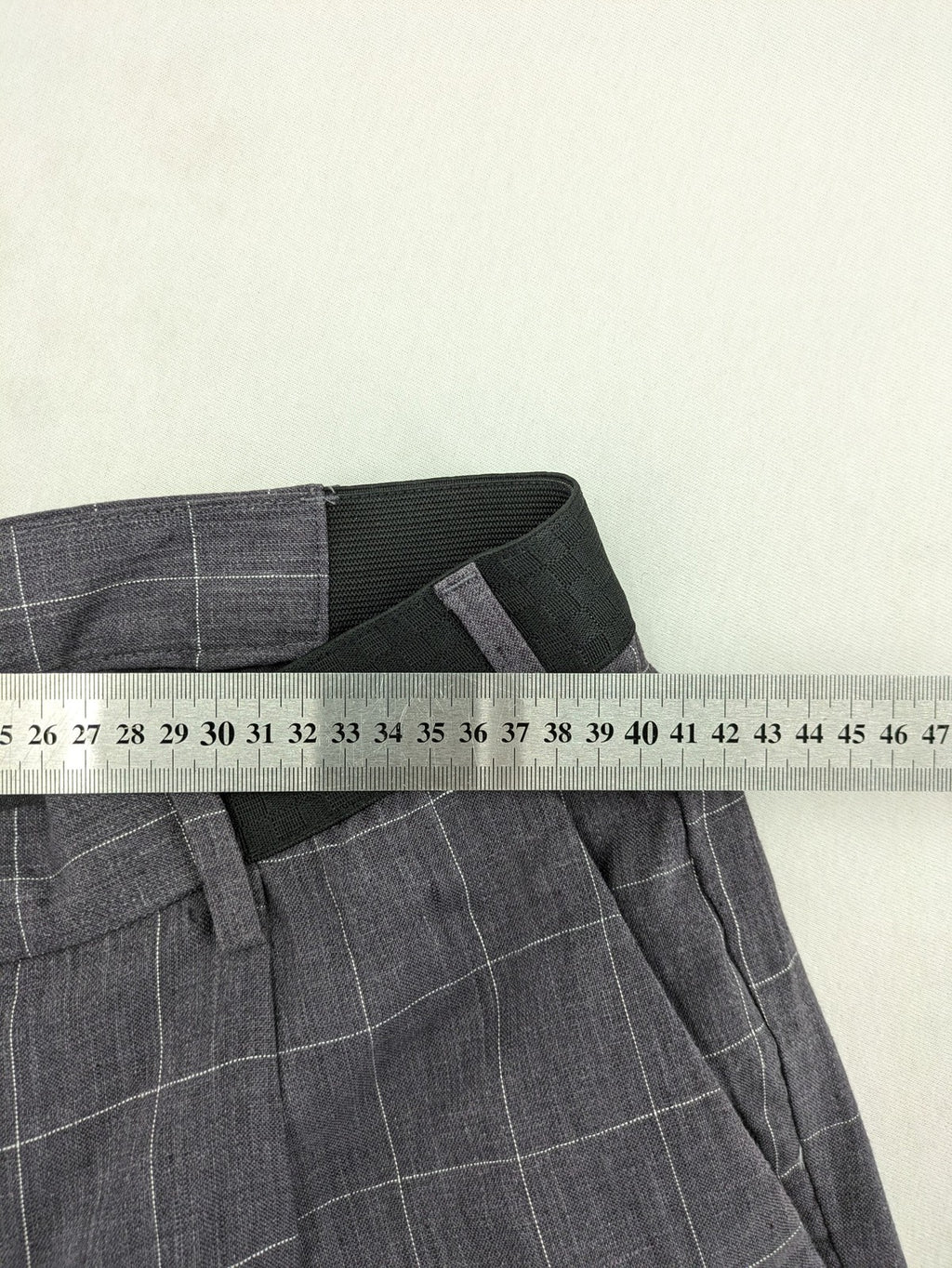 MNG Man grey plaid pants with rolled hem and stretch performance material.