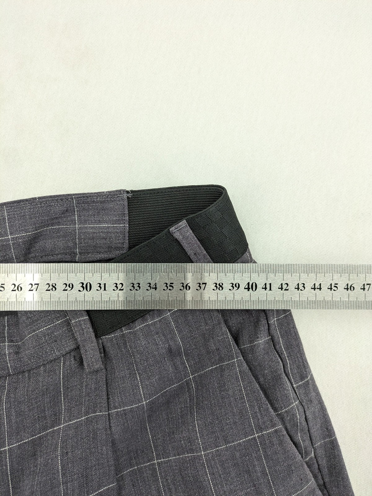 MNG Man grey plaid pants with rolled hem and stretch performance material.