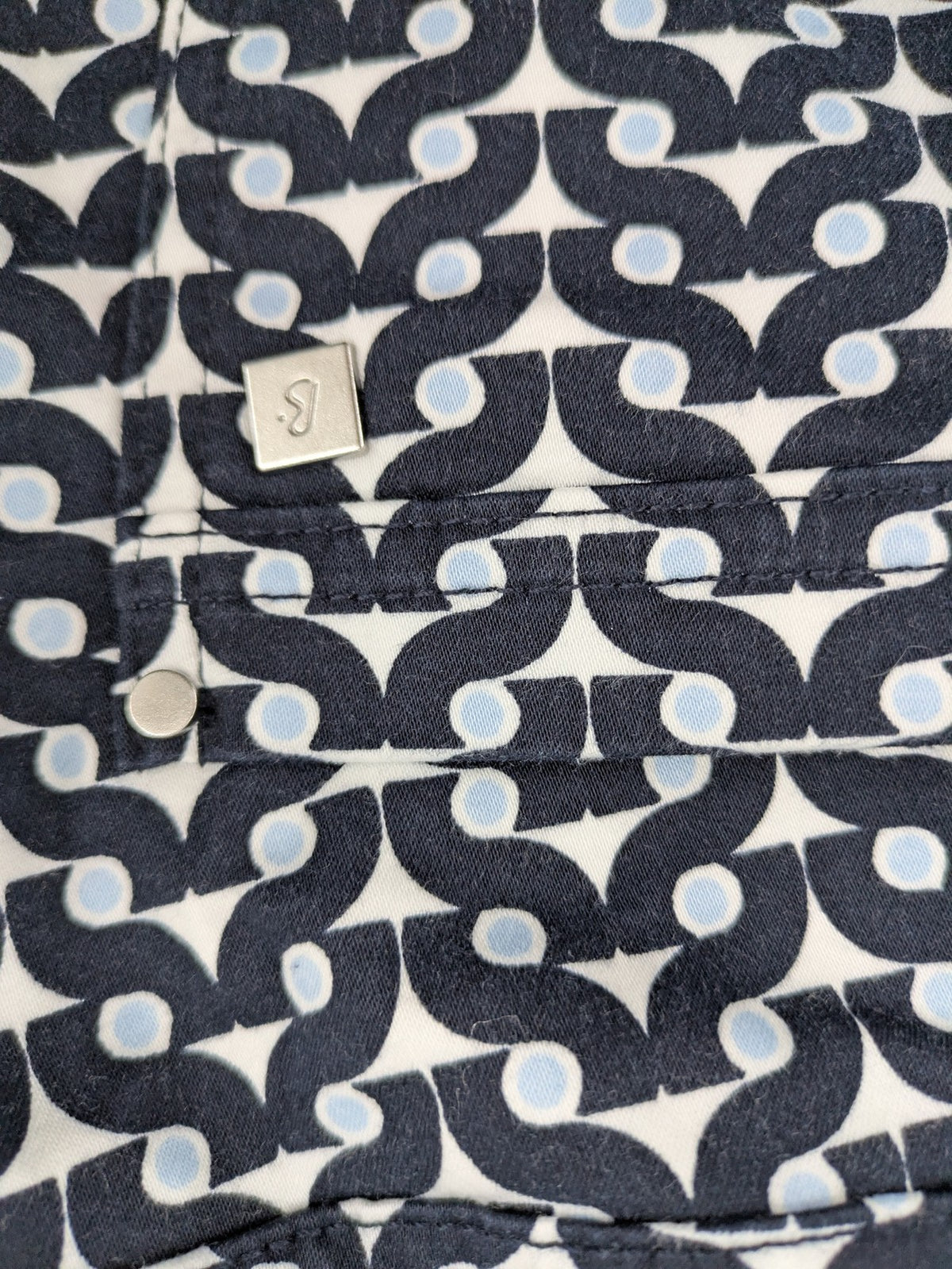 Bonita navy pants with geometric pattern, stretch material, and classic zip fly closure.