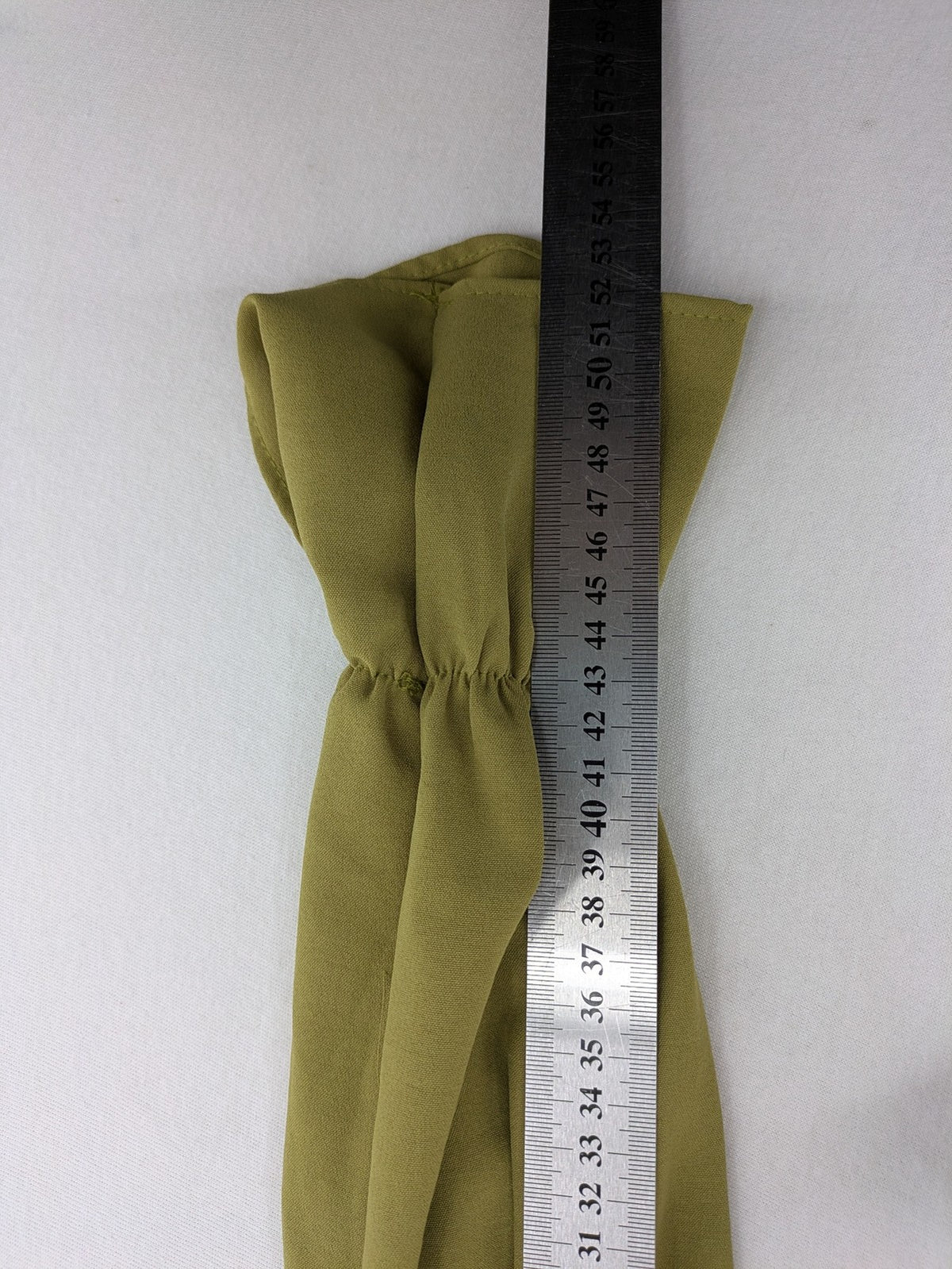 Buqre Store khaki A-line dress with puff sleeves, ruffled cuffs, and button placket.
