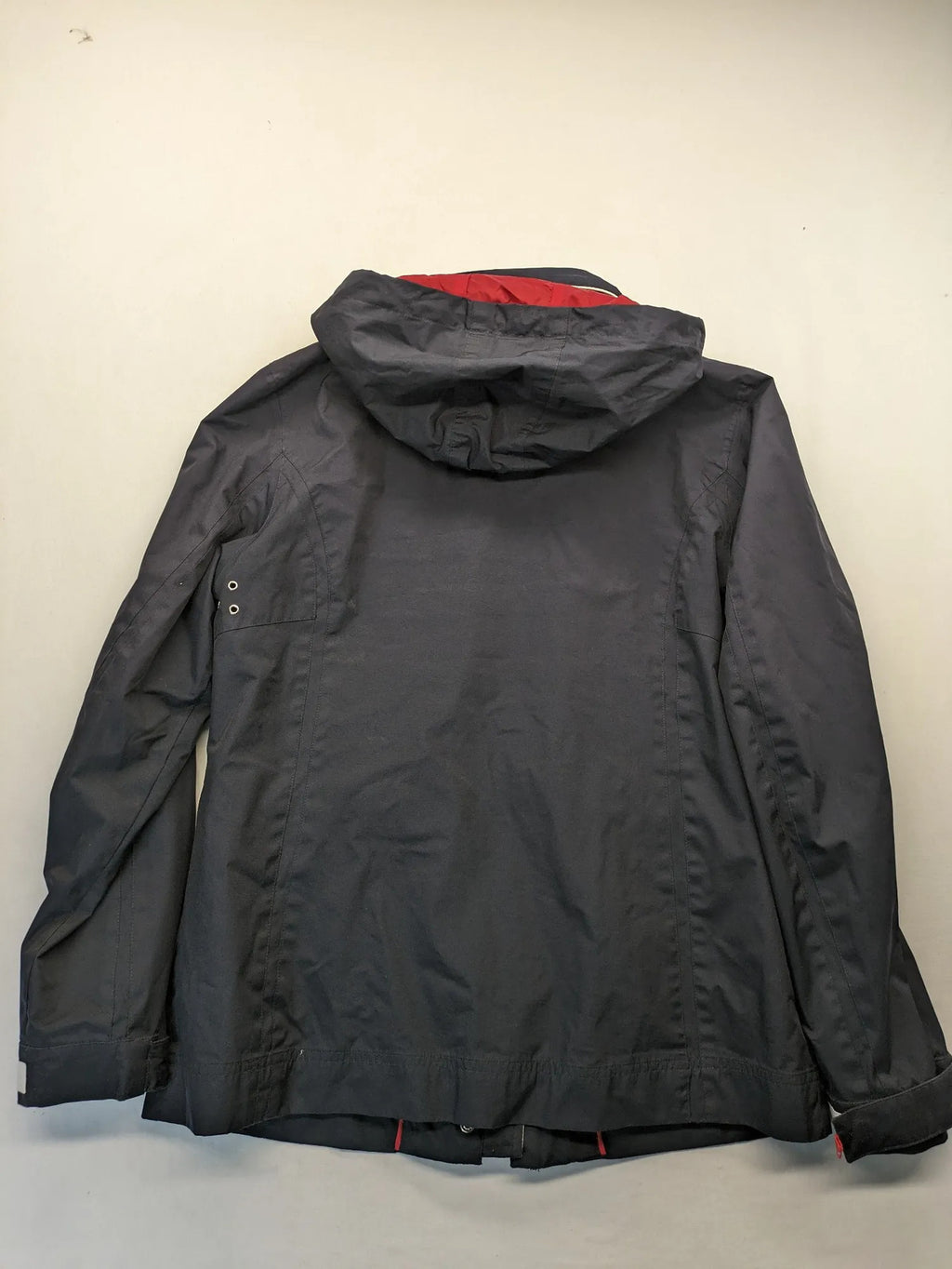WPF grey outdoor jacket with red lining, zip closure, and hood.
