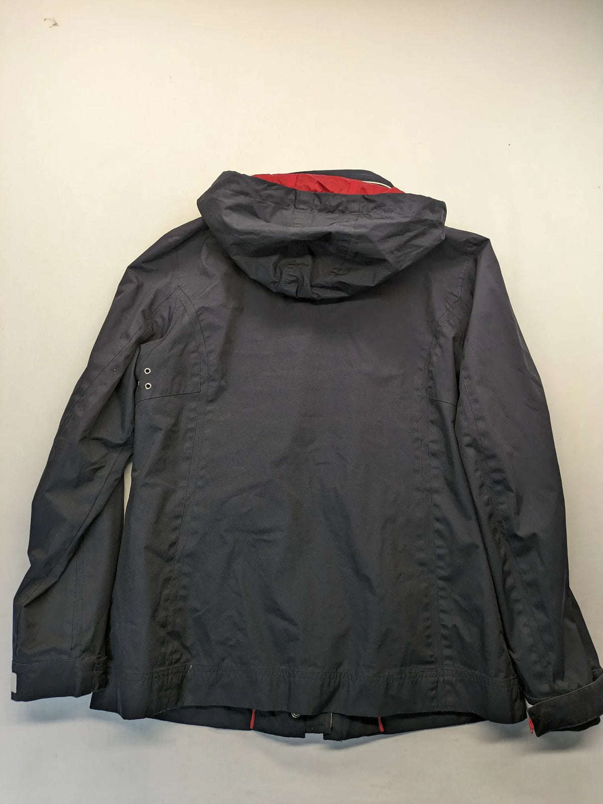 WPF grey outdoor jacket with red lining, zip closure, and hood.