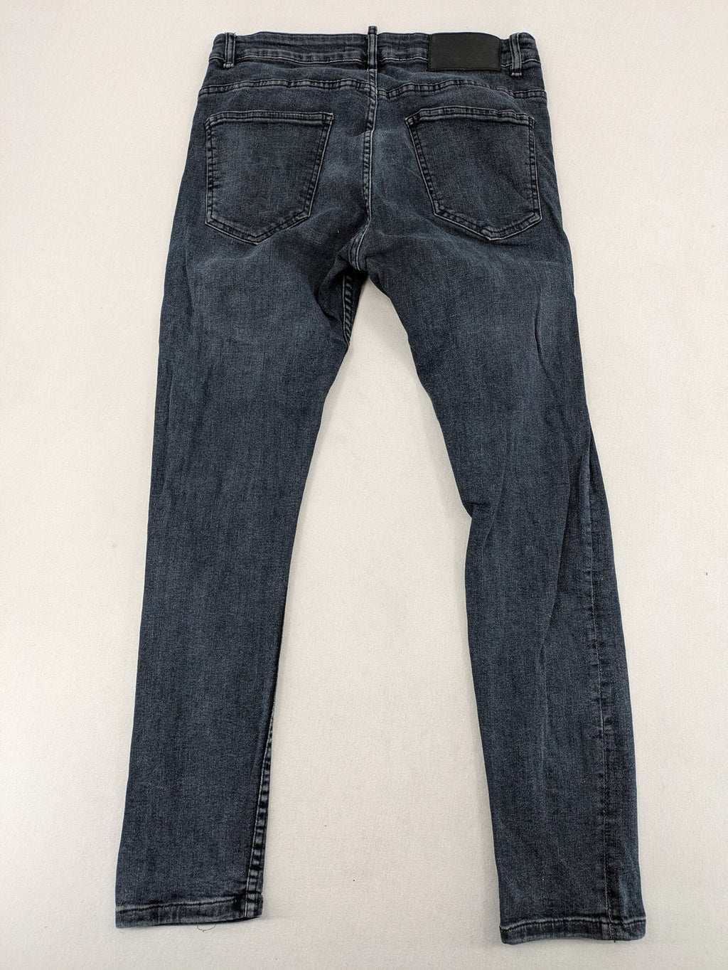 Zara blue slim fit jeans with classic 5-pocket design and subtle wash effect.