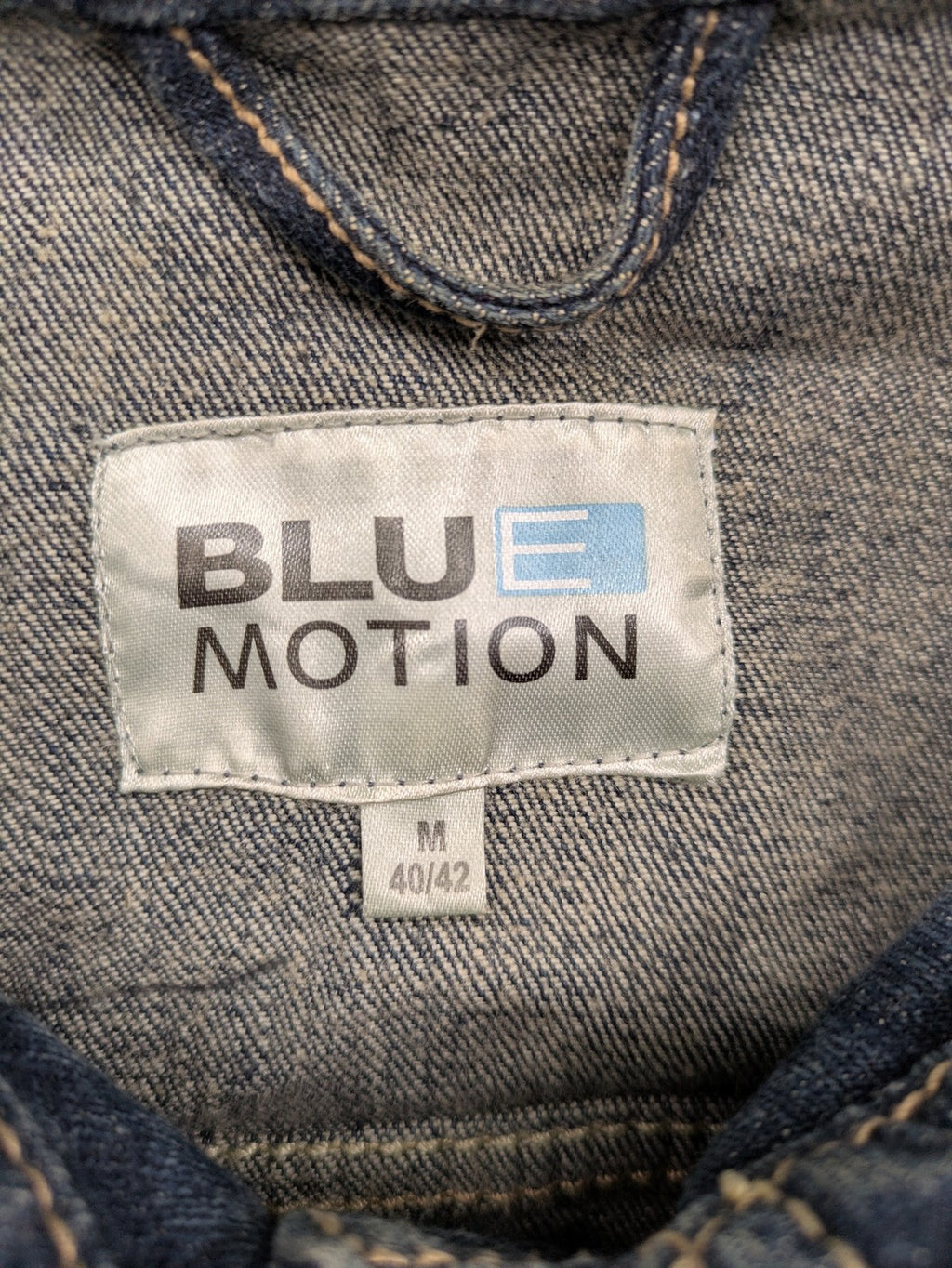 BLU blue denim trucker jacket with button placket and two chest pockets.