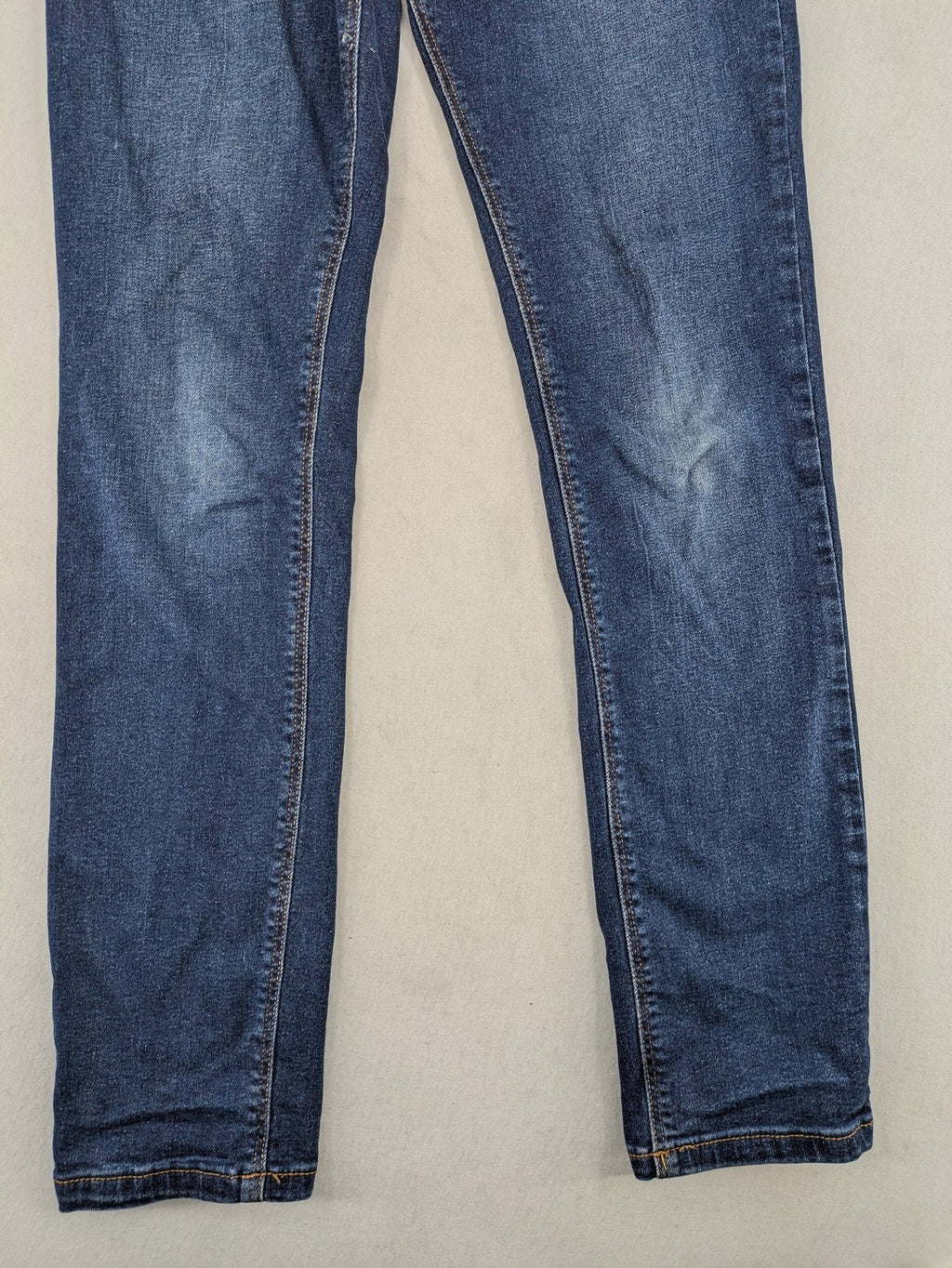 Denim & Co. blue skinny stretch jeans, five-pocket design, dark wash, durable material.