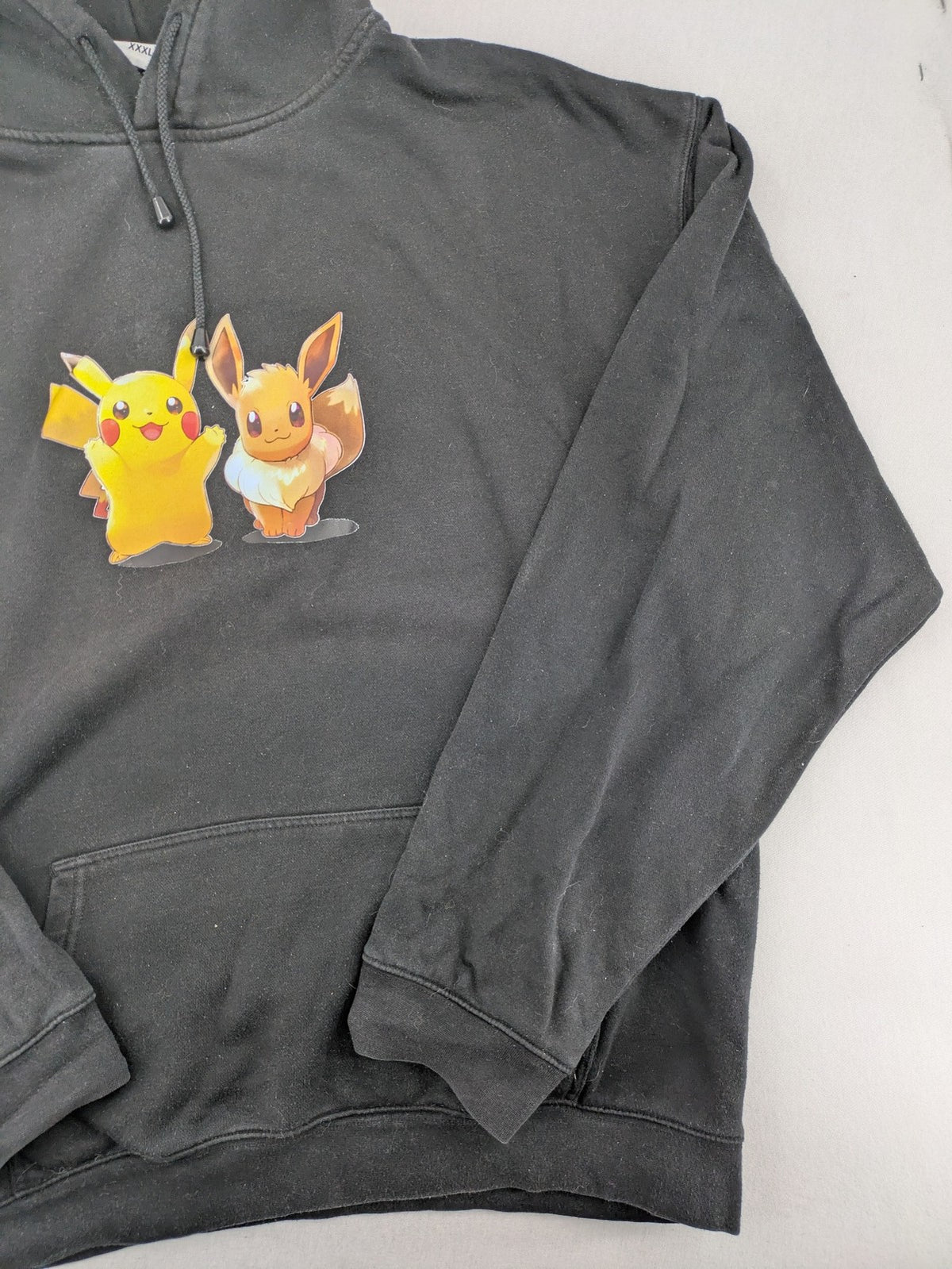 Pokémon black hoodie featuring colorful Pikachu and Evoli graphic, classic pullover style.