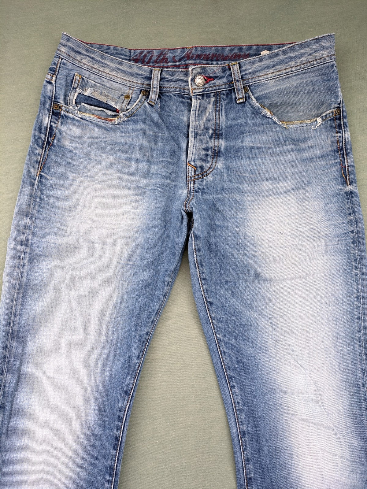 Pepe Jeans blue straight jeans with Union Jack embroidery and distressed denim finish.