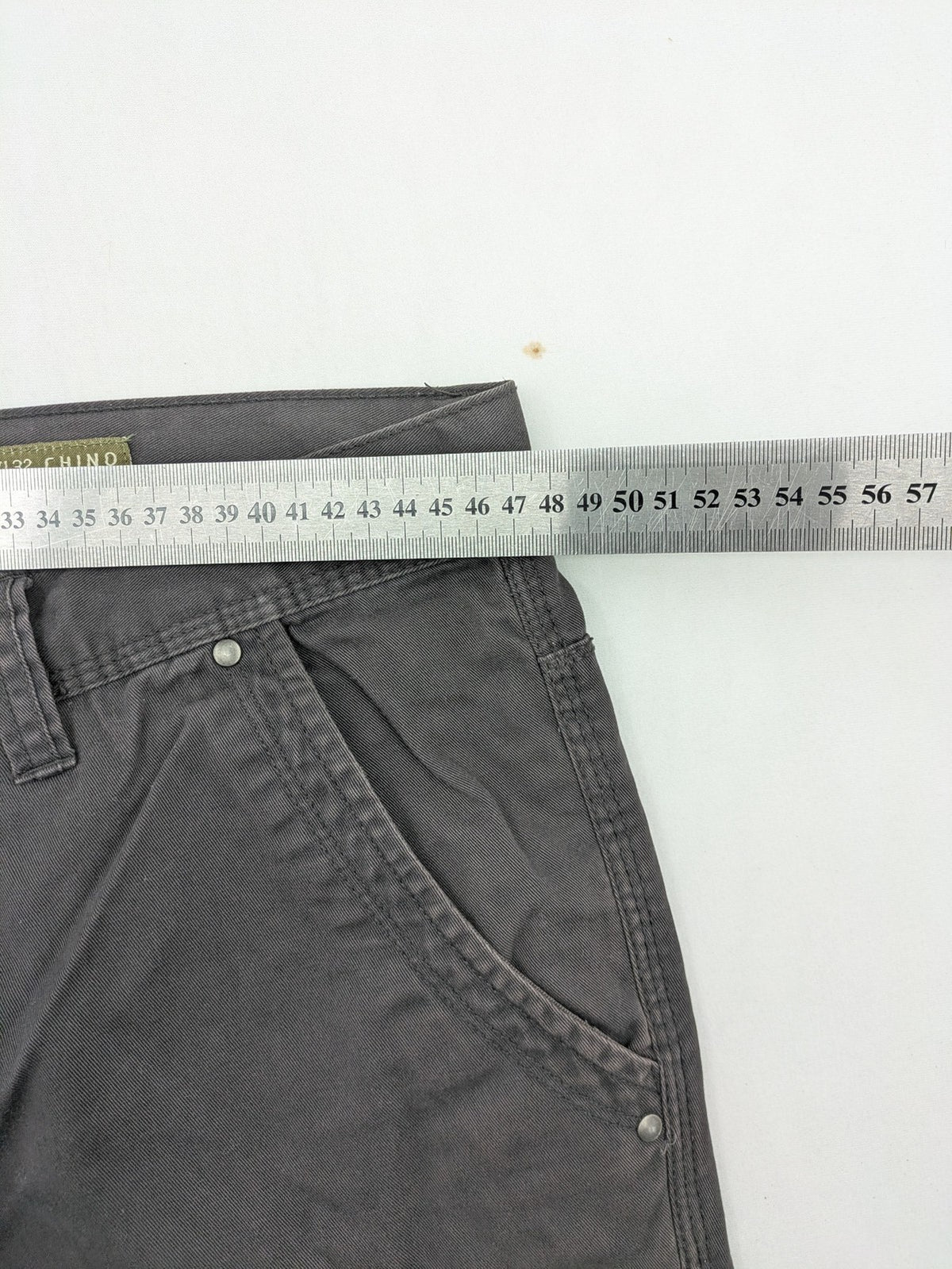 Denim & Co. grey chino pants cotton workwear with button fly and pocket rivets.