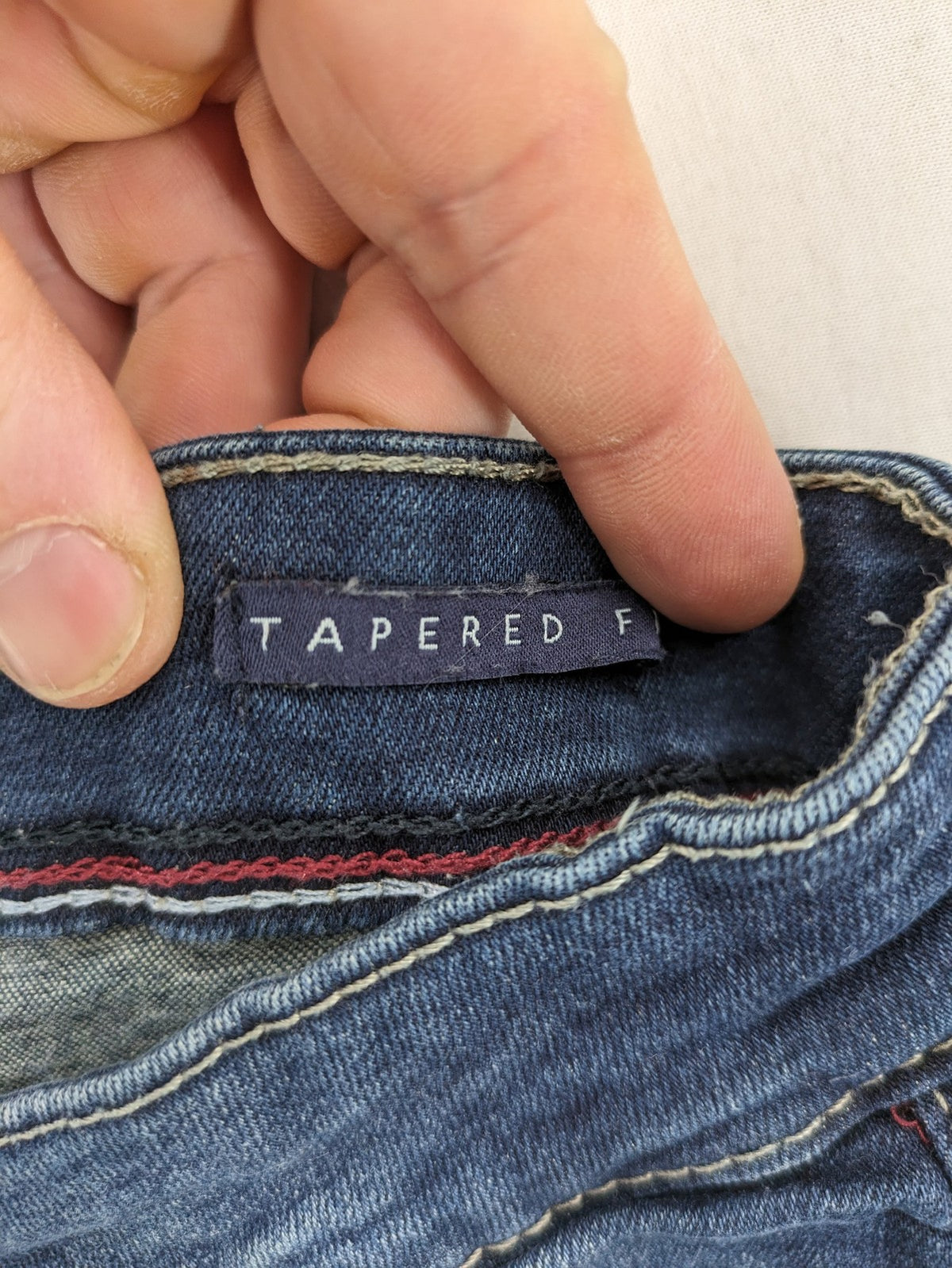 Jack's blue tapered jeans with light wash, 98% cotton, 2% elastane blend.